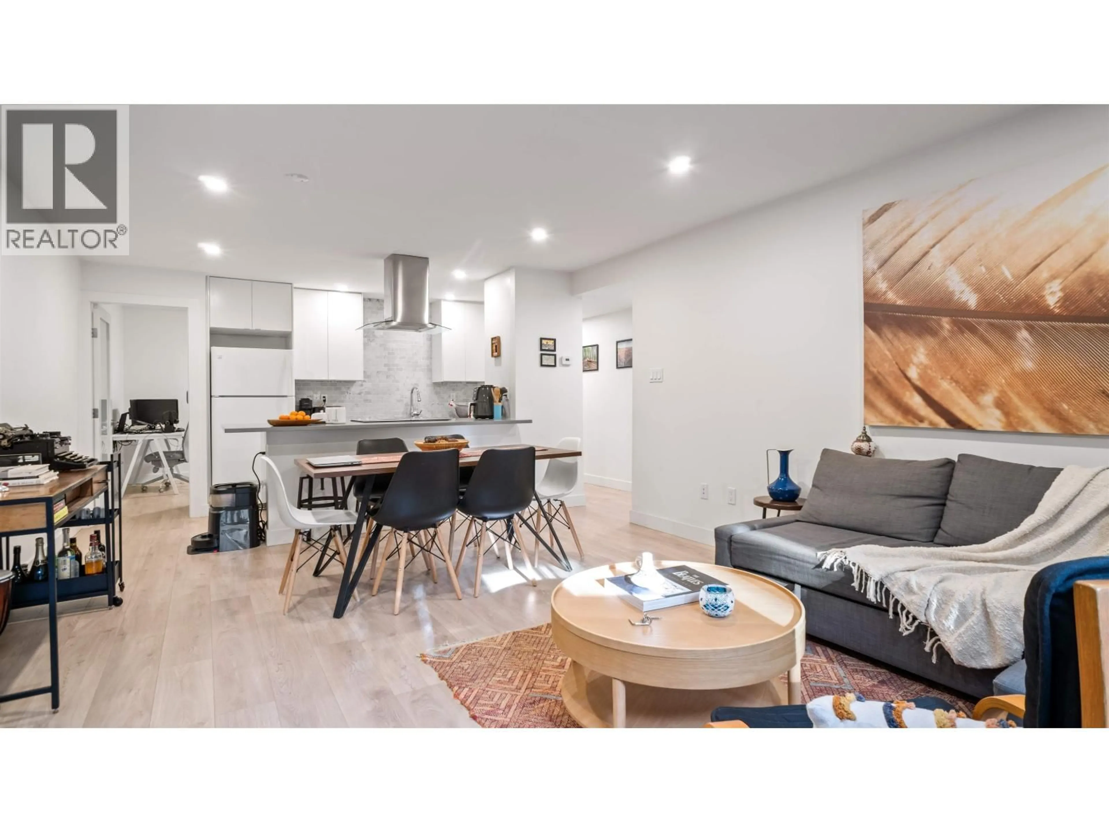 Open concept kitchen, wood/laminate floor for 318 - 1345 15TH AVENUE, Vancouver British Columbia V6H3R3