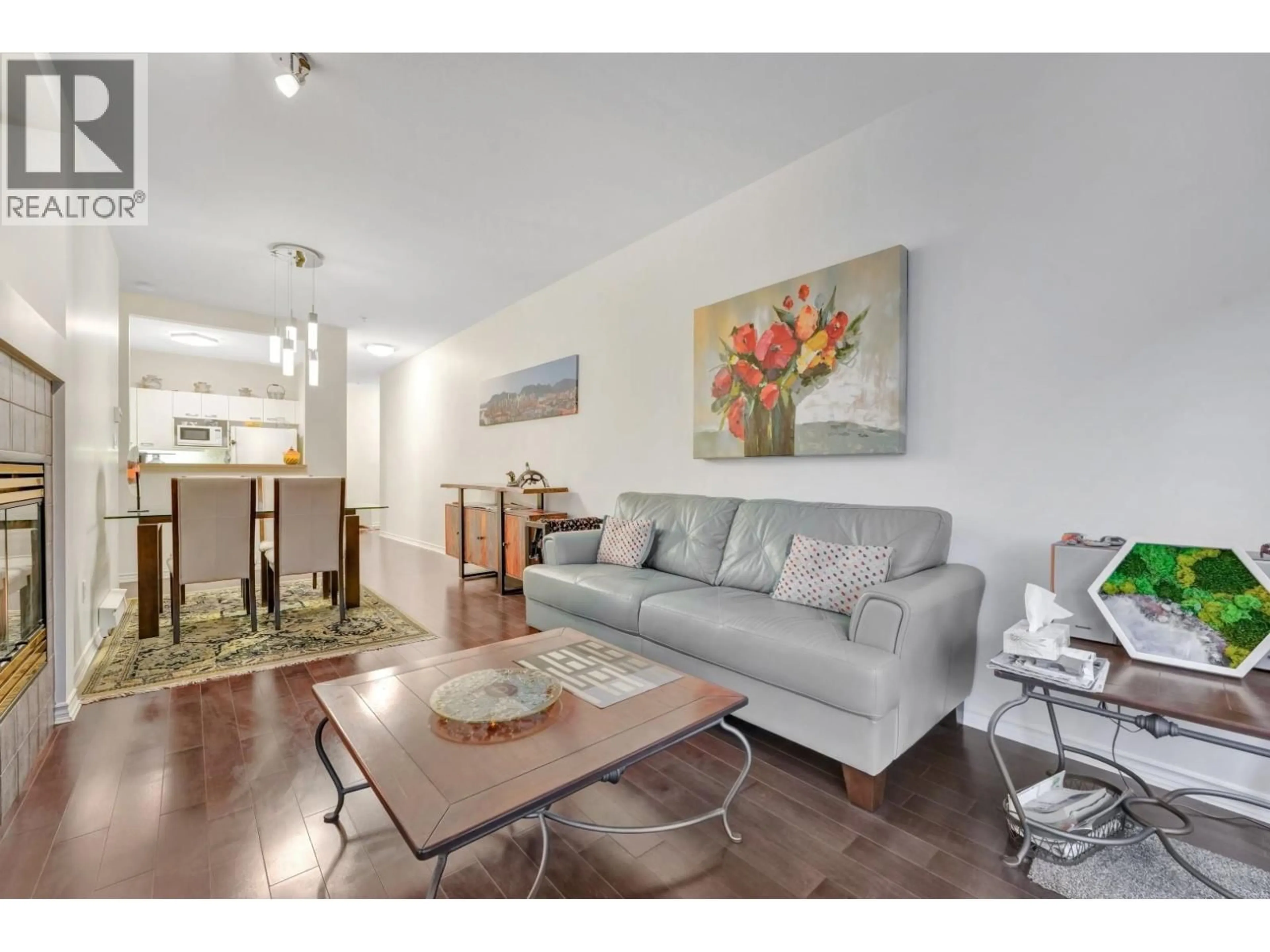 Living room with furniture, wood/laminate floor for 208 - 588 TWELFTH STREET, New Westminster British Columbia V3M4H9