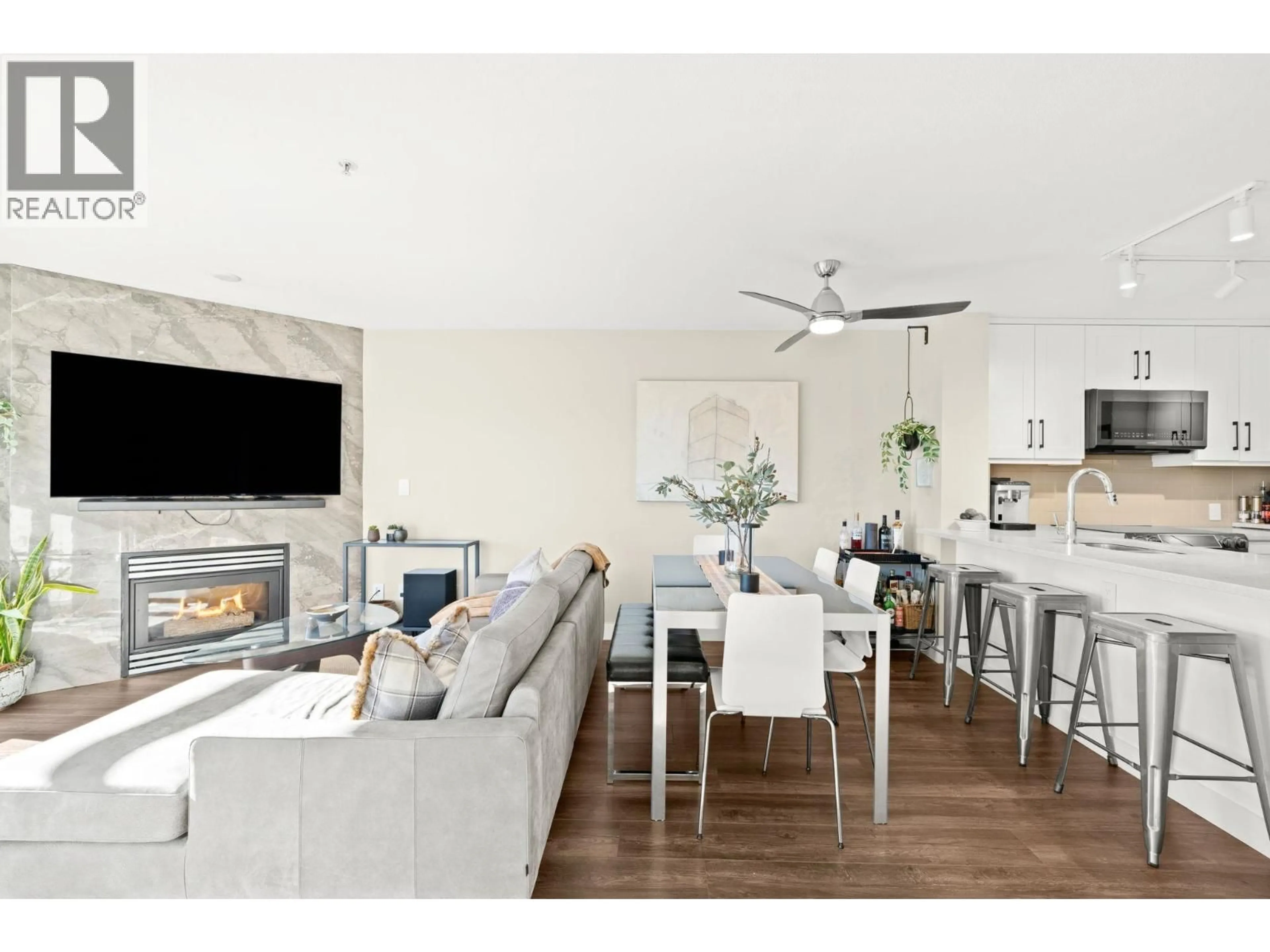 Open concept kitchen, wood/laminate floor for 410 - 124 3RD STREET, North Vancouver British Columbia V7M1E8