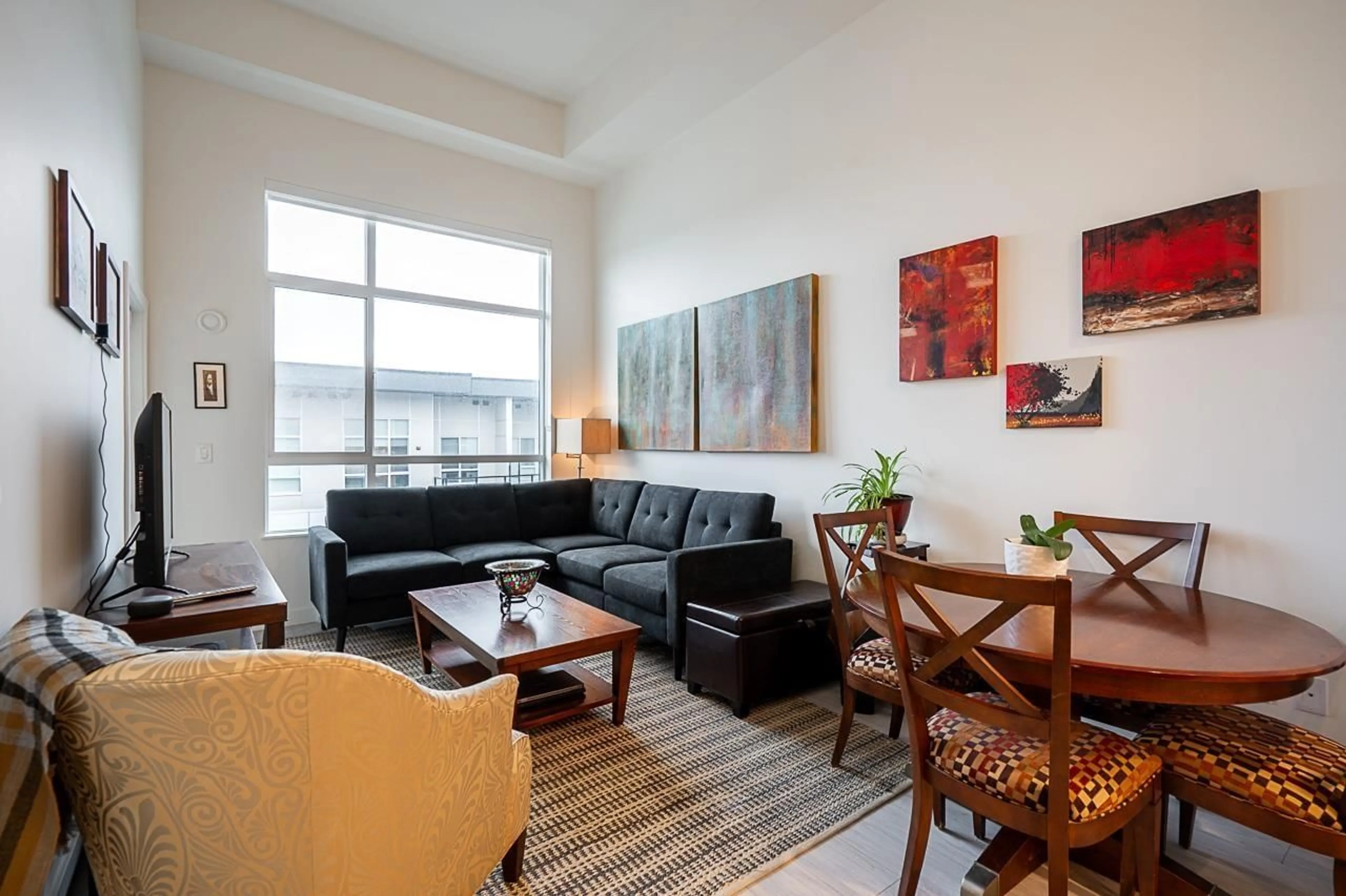 Living room with furniture, wood/laminate floor for A615 - 20834 80 AVENUE, Langley British Columbia V2Y3M4