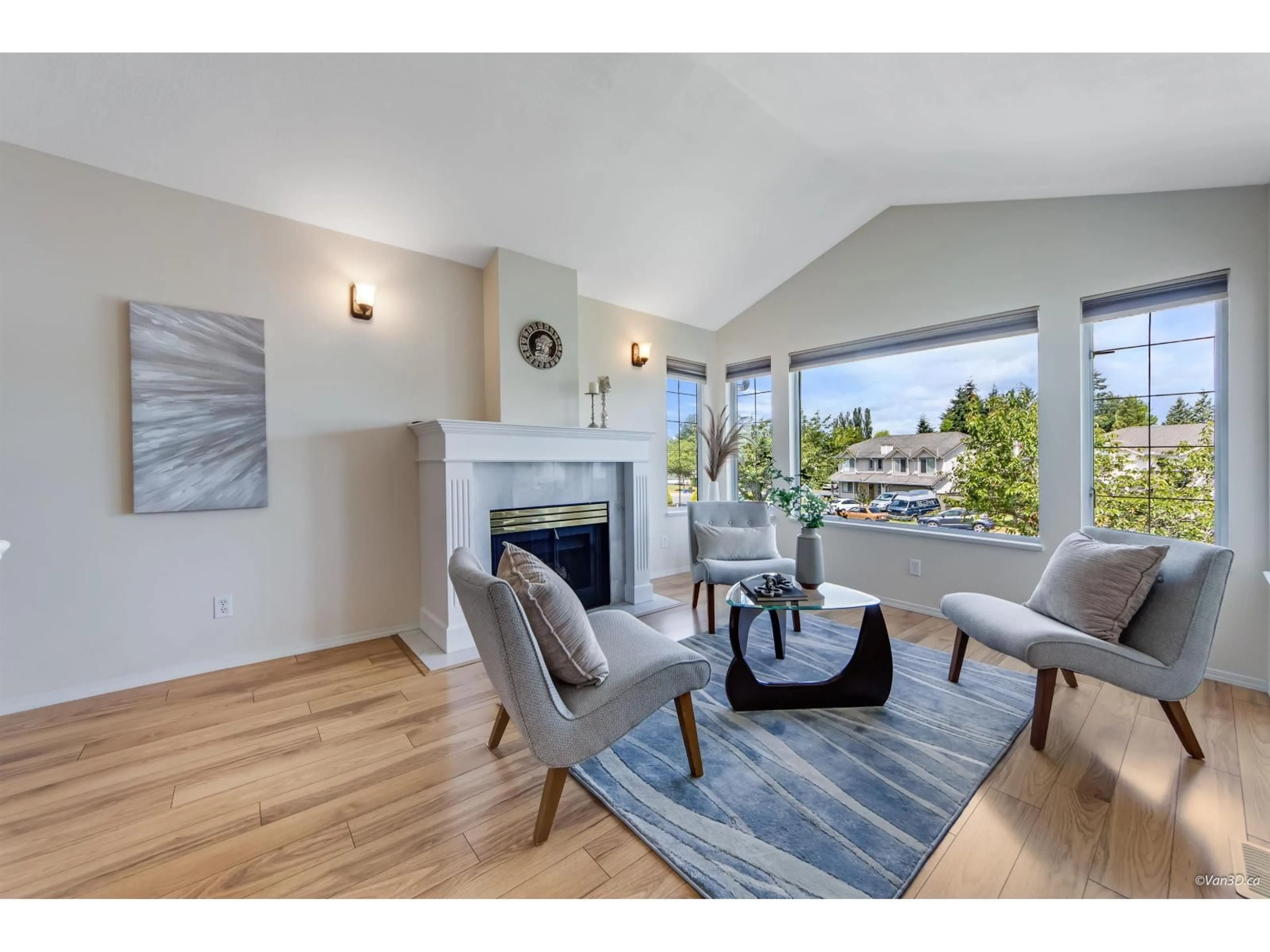 Living room with furniture, wood/laminate floor for 21562 51 AVENUE, Langley British Columbia V3A8V8