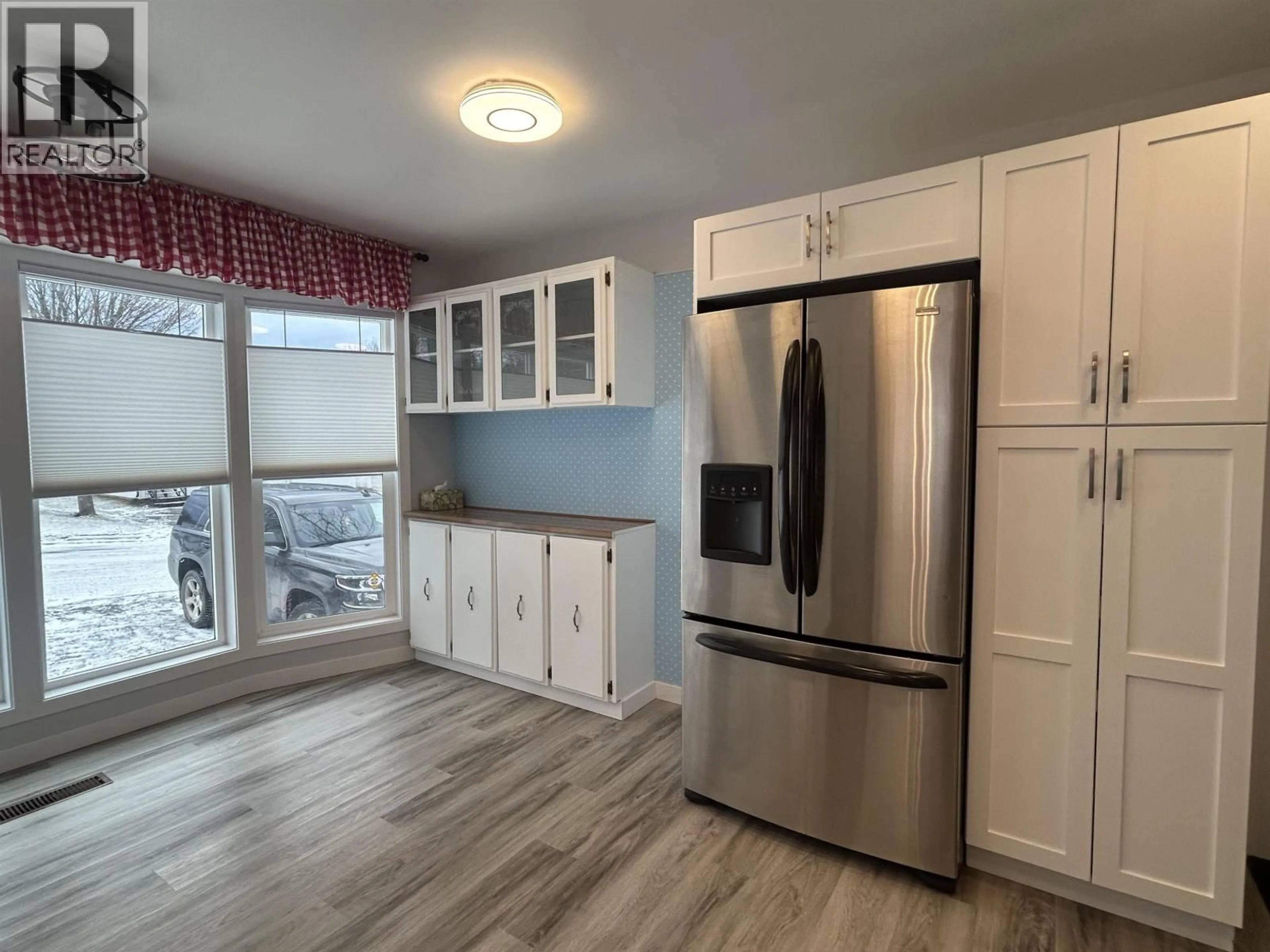 Open concept kitchen, wood/laminate floor for 82 - 1000 INVERNESS ROAD, Prince George British Columbia V2K4V1