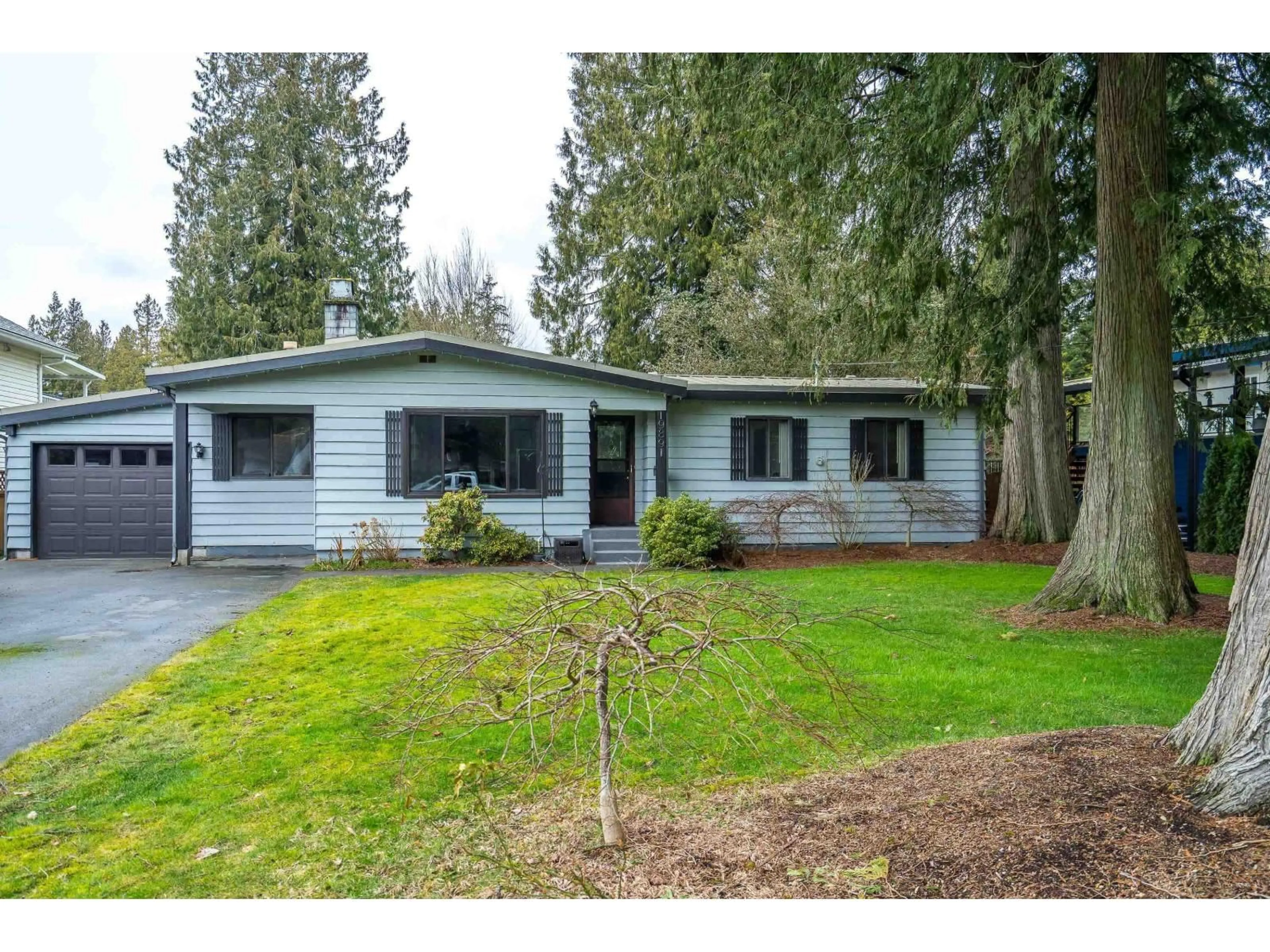 Home with vinyl exterior material, street for 19891 43A AVENUE, Langley British Columbia V3A3C3