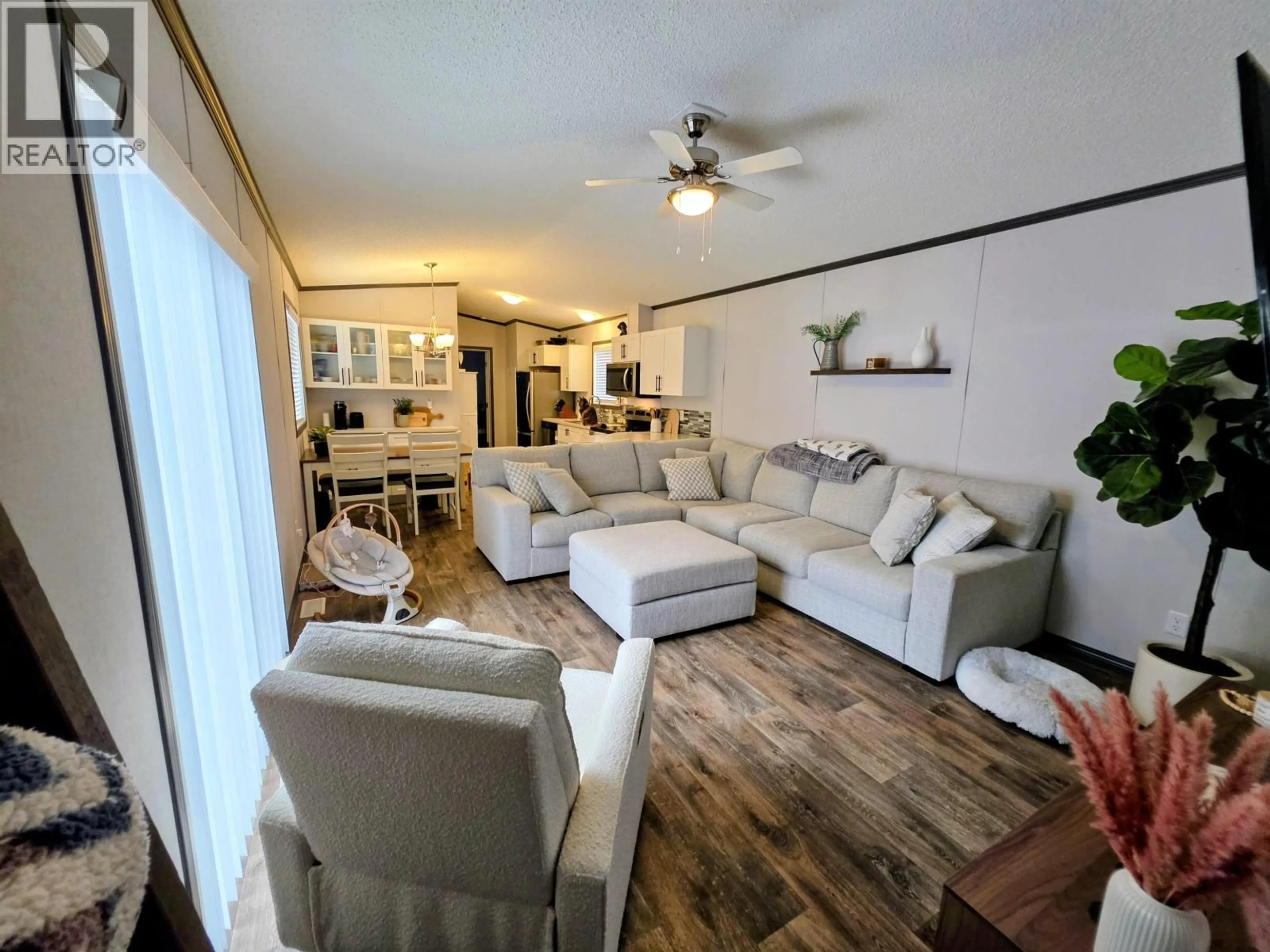 Living room with furniture, wood/laminate floor for B3 - 5931 COOK COURT, Prince George British Columbia V2K3A3