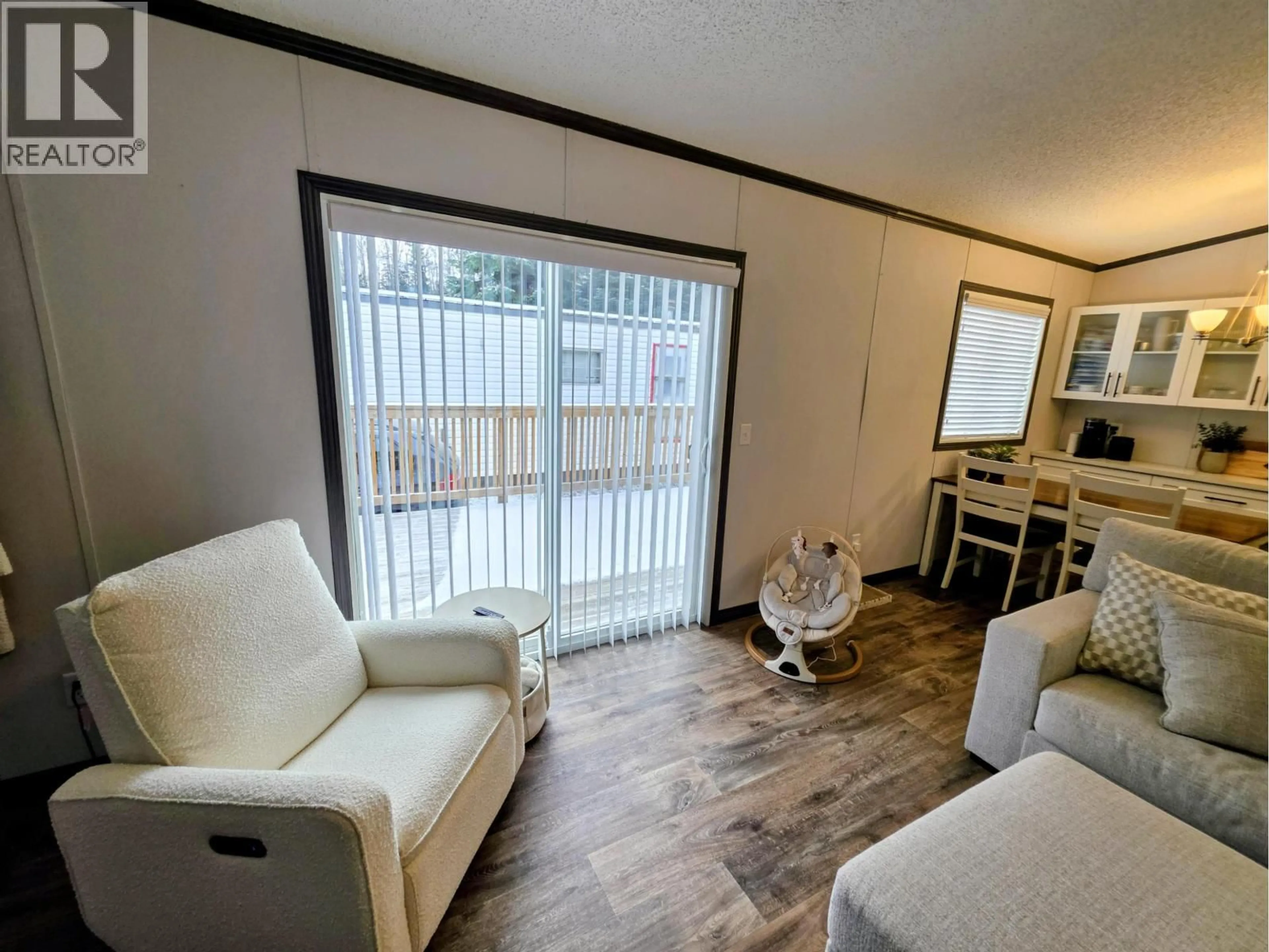 Living room with furniture, wood/laminate floor for B3 - 5931 COOK COURT, Prince George British Columbia V2K3A3
