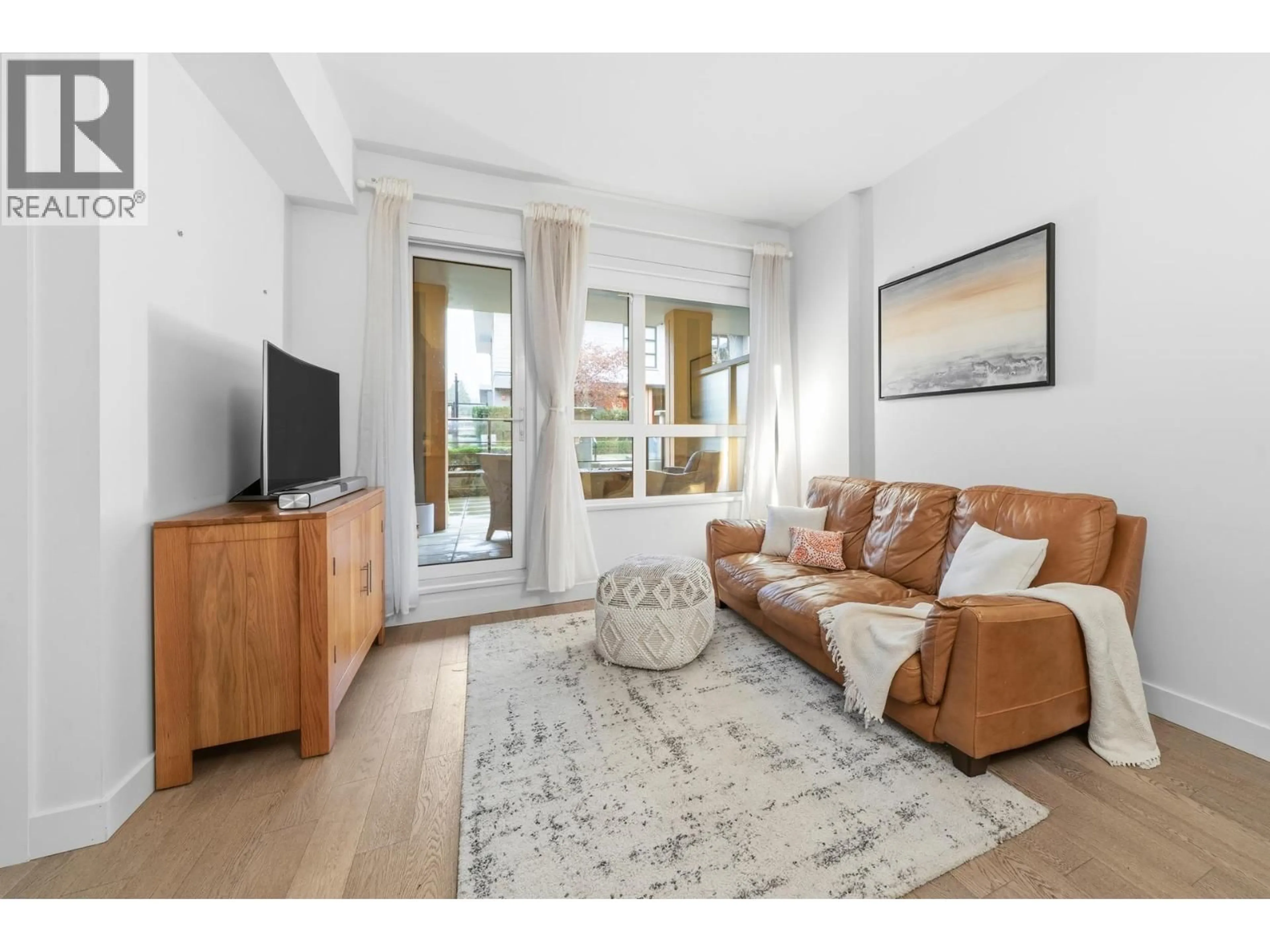 Living room with furniture, unknown for 201 - 3220 CONNAUGHT CRESCENT, North Vancouver British Columbia V7R0A5