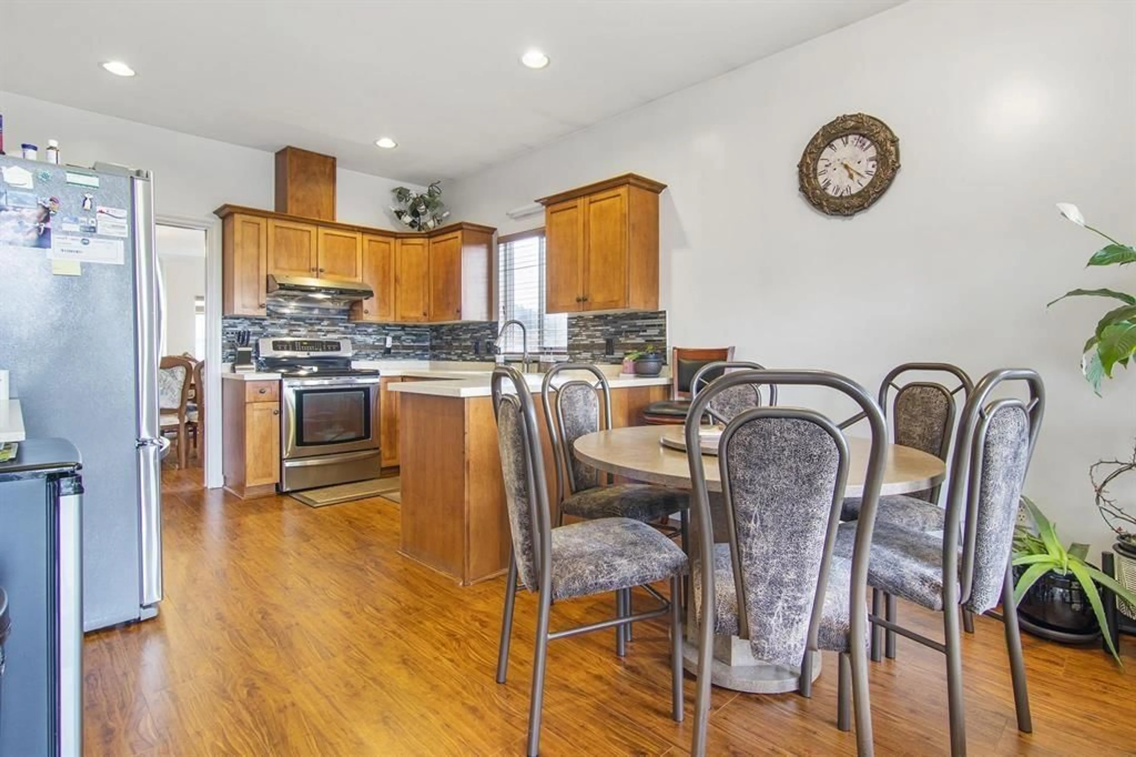 Open concept kitchen, wood/laminate floor for 8025 D'HERBOMEZ DRIVE, Mission British Columbia V2V7B7