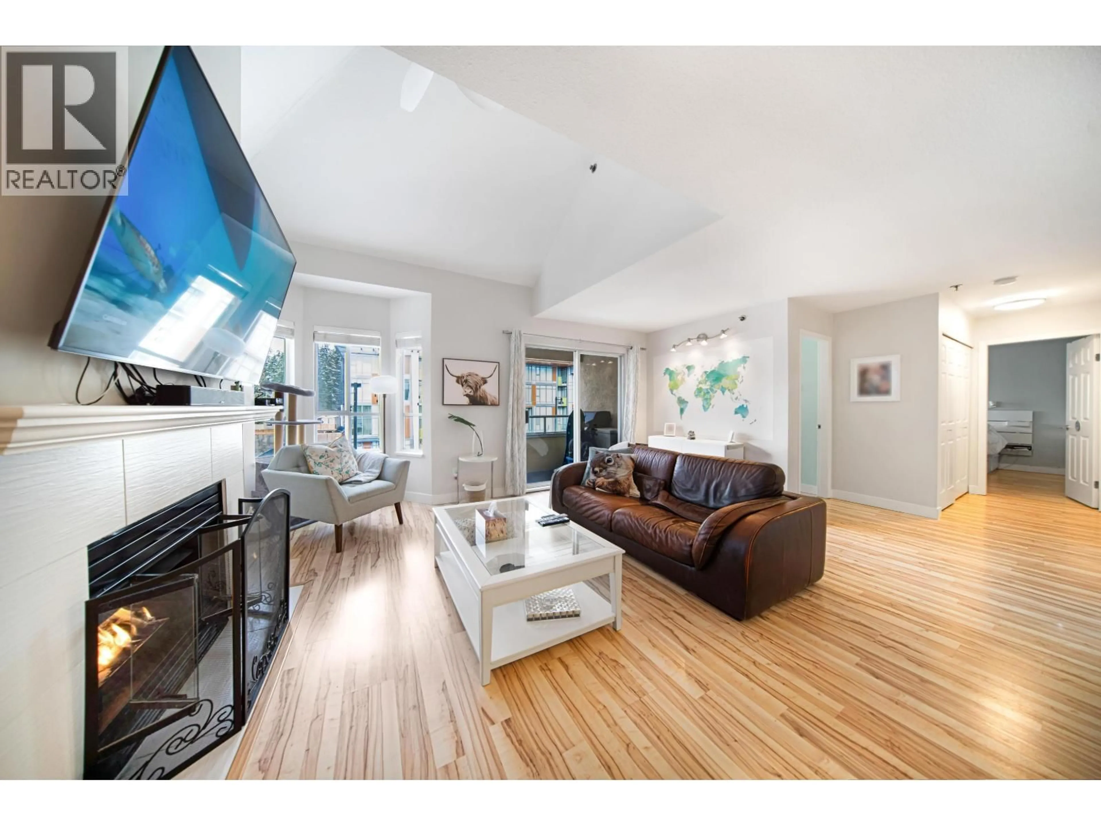 Living room with furniture, wood/laminate floor for 305 - 1175 HEFFLEY CRESCENT, Coquitlam British Columbia V3B7J2