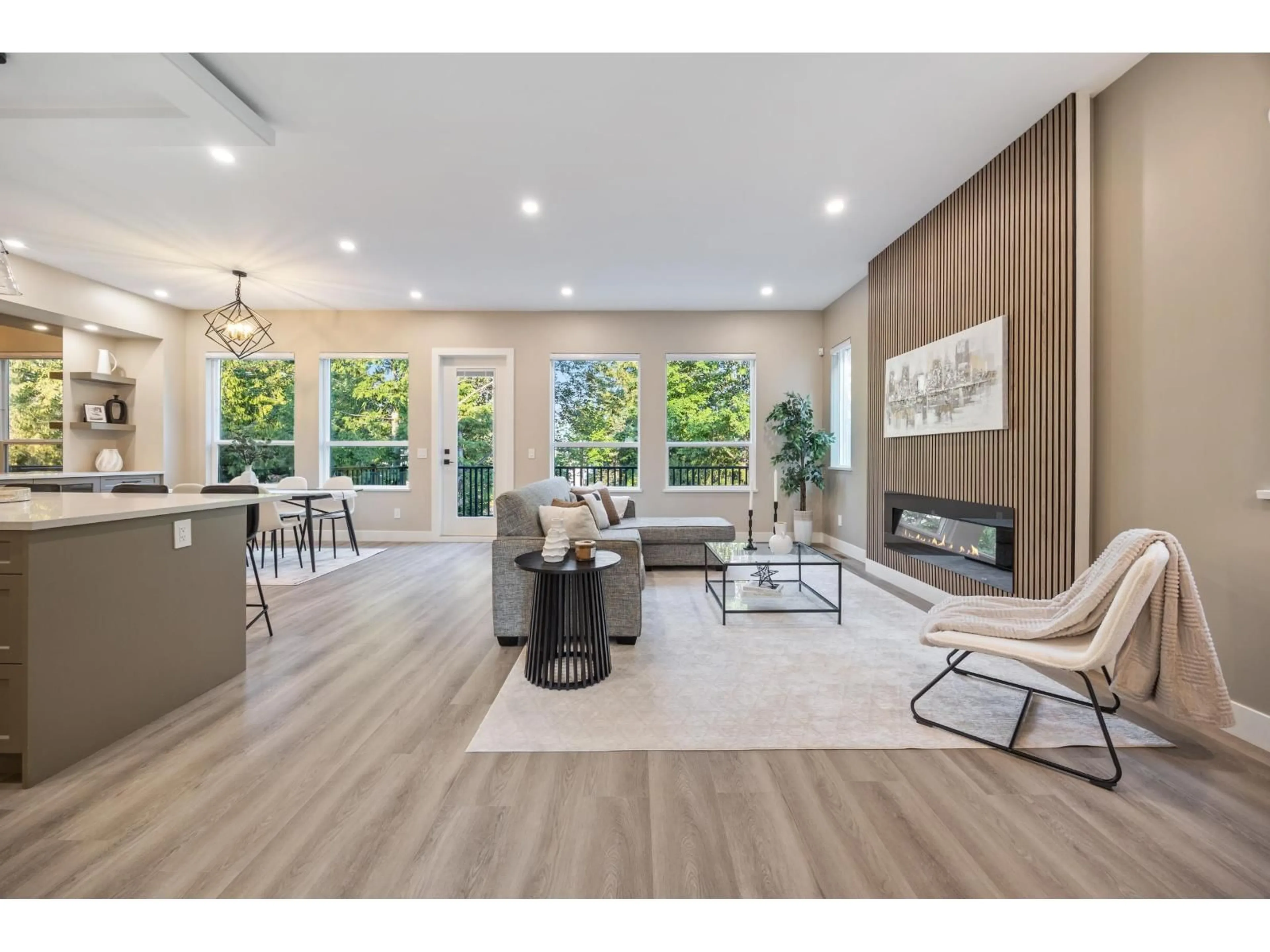 Living room with furniture, wood/laminate floor for 7024 205 STREET, Langley British Columbia V2Y1S9