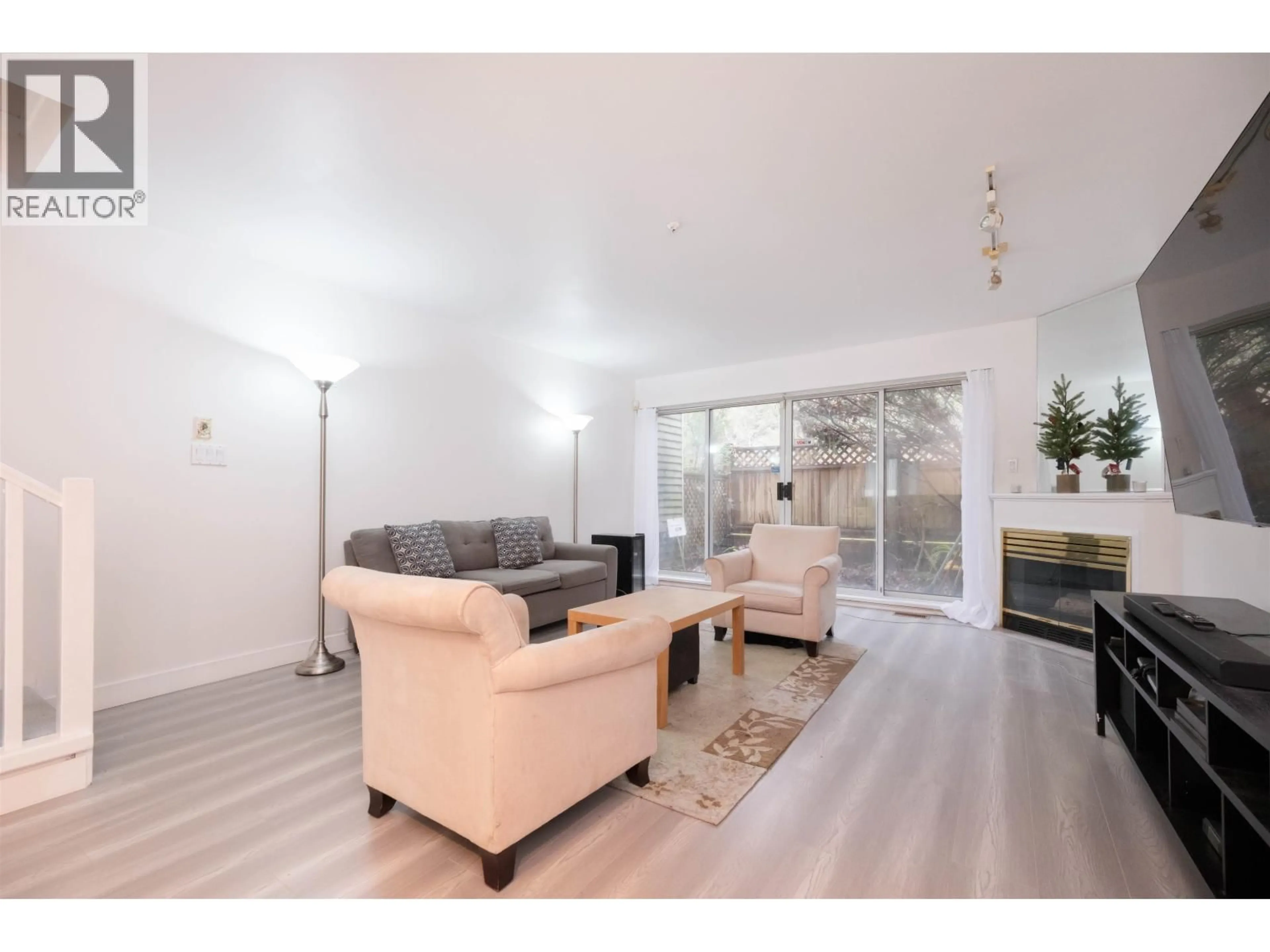 Living room with furniture, wood/laminate floor for 3371 FIELDSTONE AVENUE, Vancouver British Columbia V5S4R9