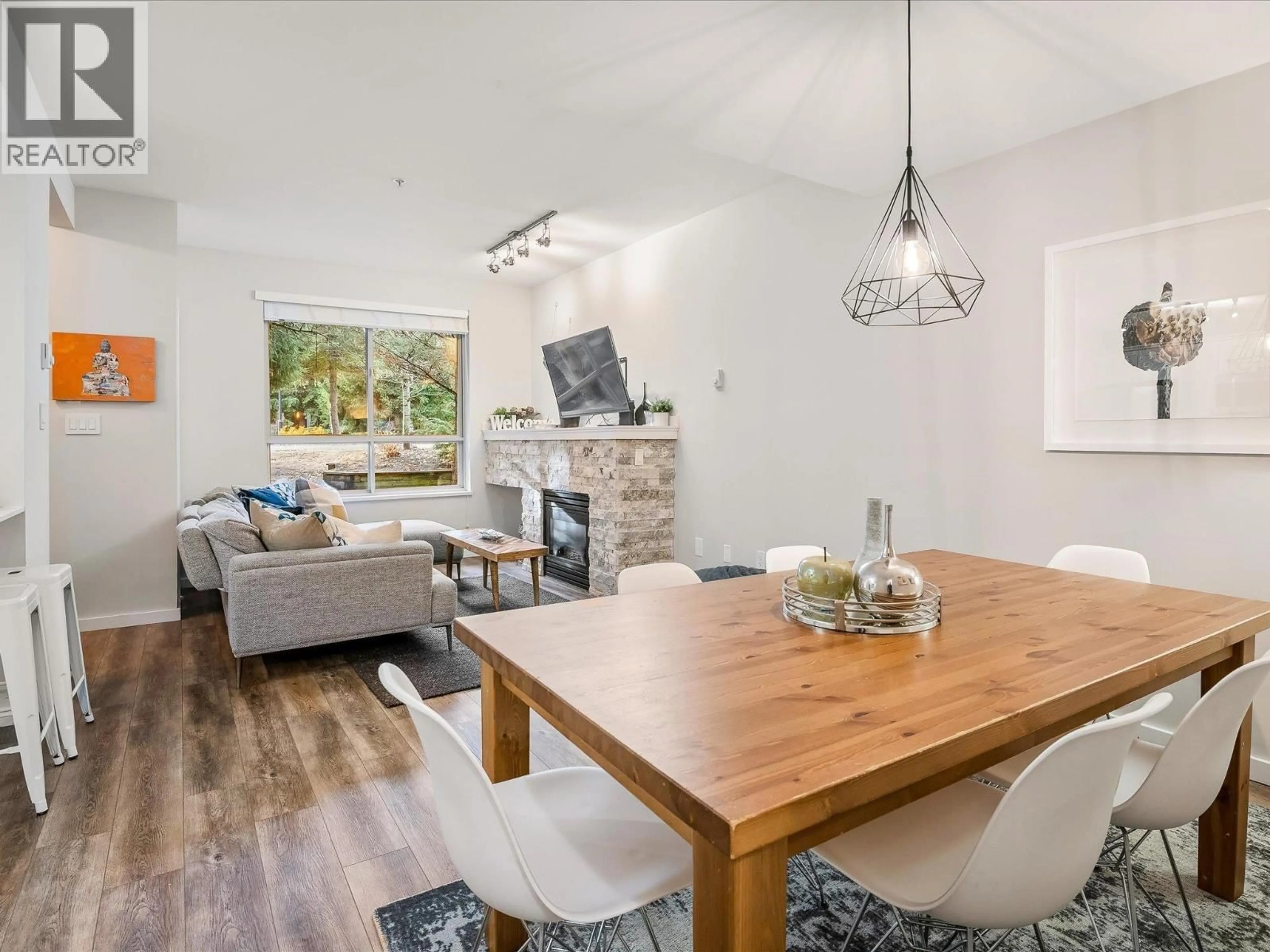 Living room with furniture, wood/laminate floor for 7 - 4385 NORTHLANDS BOULEVARD, Whistler British Columbia V8E1C5