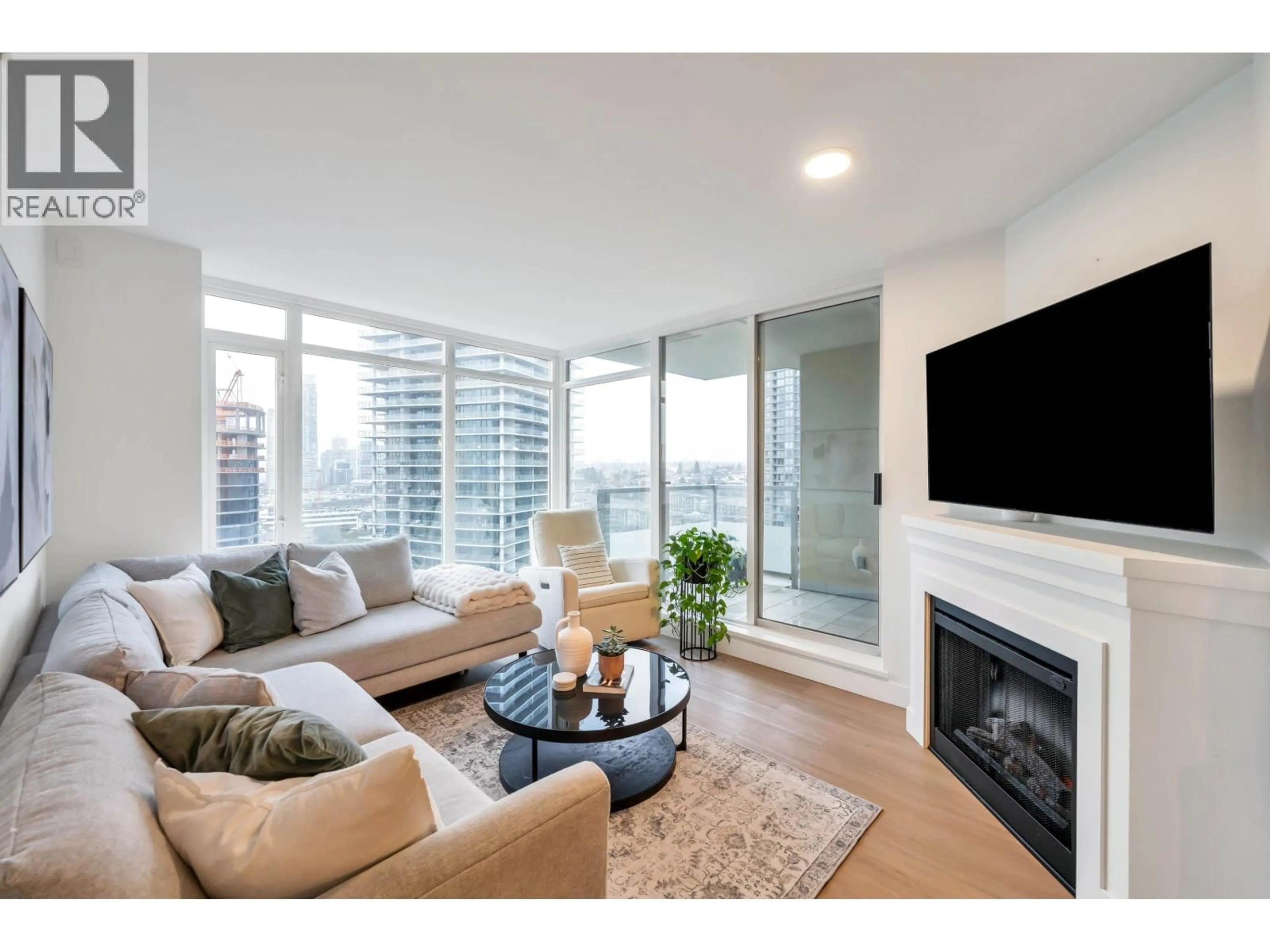 Living room with furniture, wood/laminate floor for 2201 - 2133 DOUGLAS ROAD, Burnaby British Columbia V5C0E9