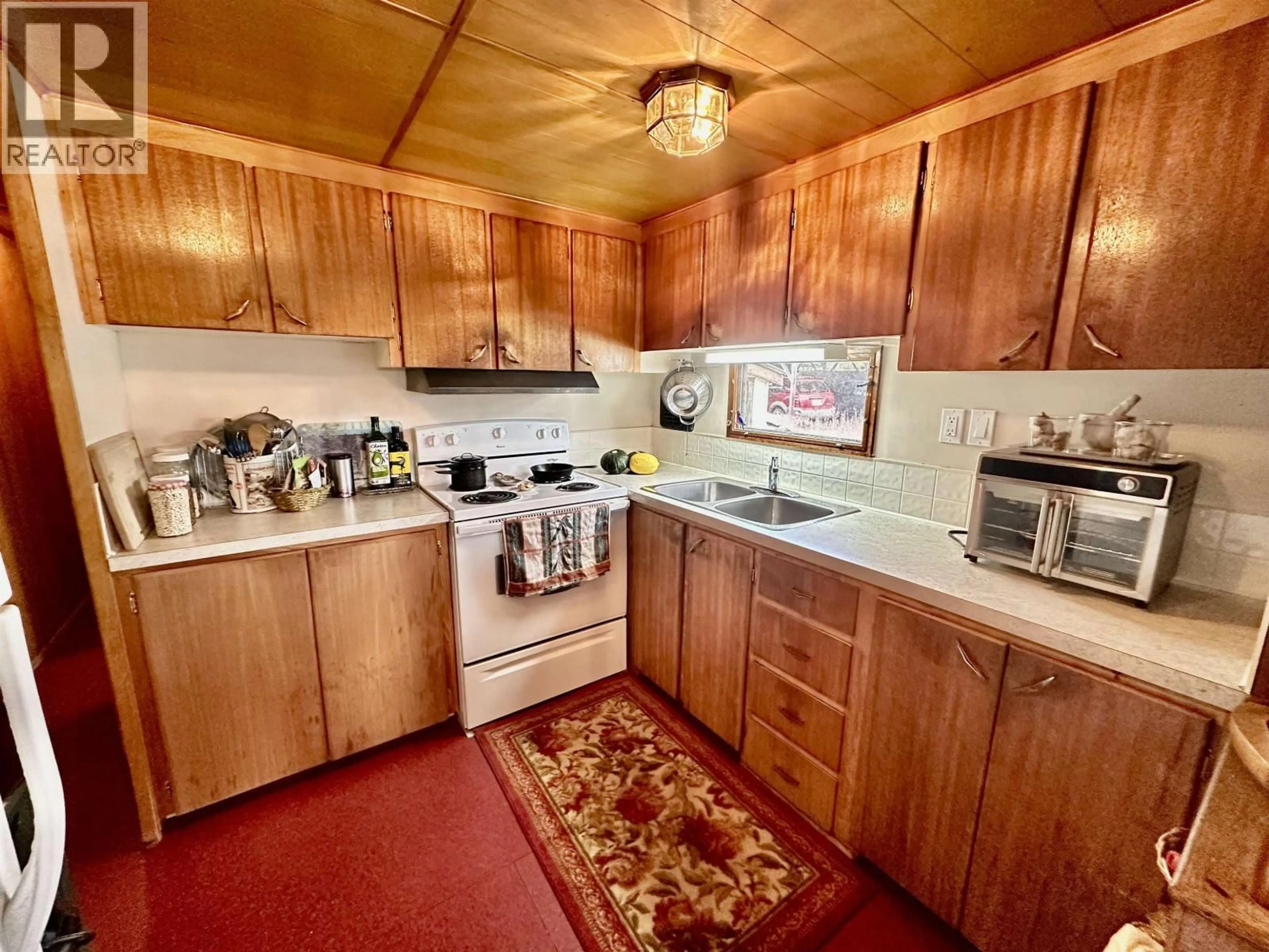 Standard kitchen, unknown for 6808 STOKES ROAD, 100 Mile House British Columbia V0K2E2