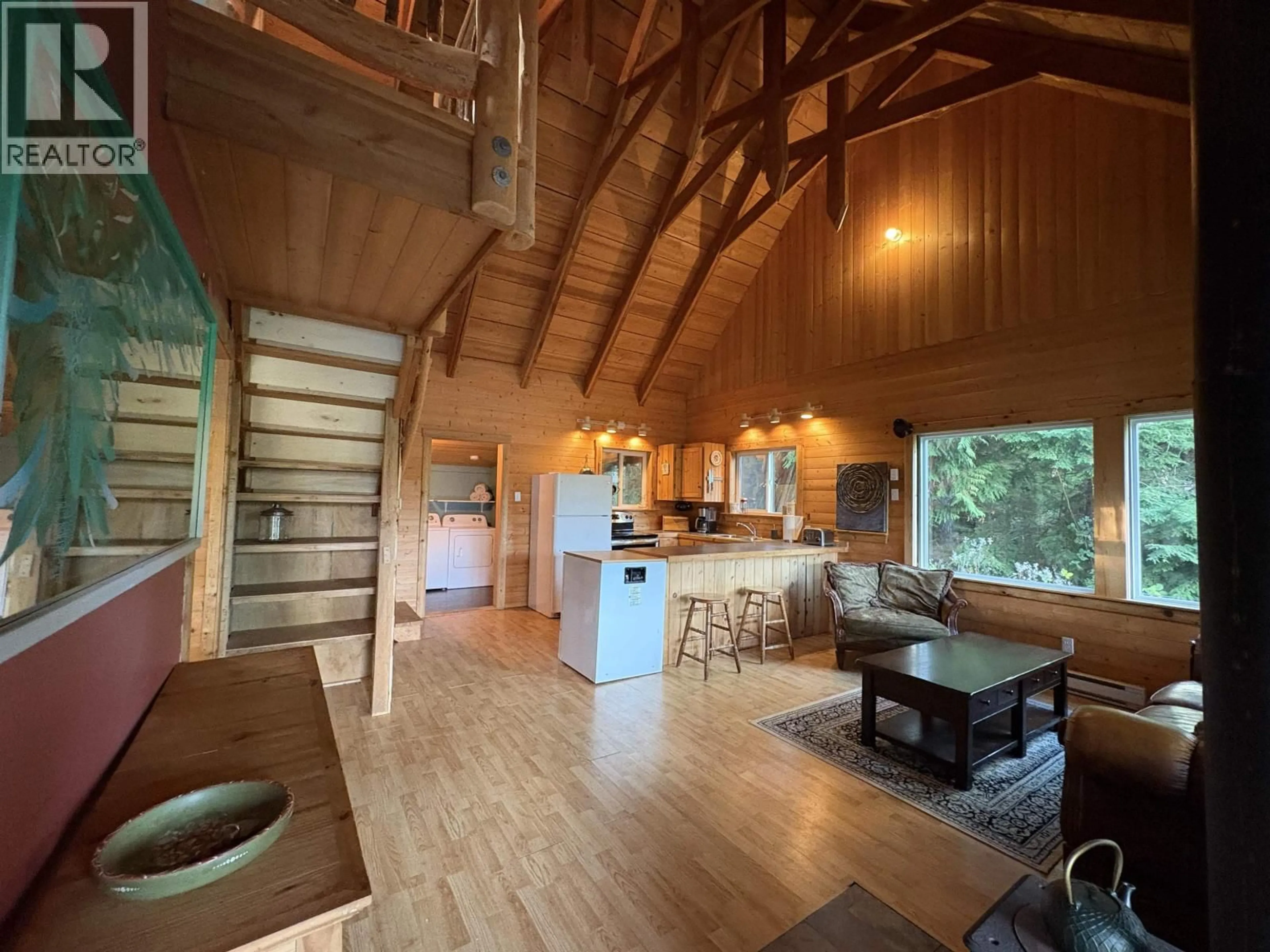 Open concept kitchen, wood/laminate floor for 815 THE GROVE ROAD, Gambier Island British Columbia V0N1V0