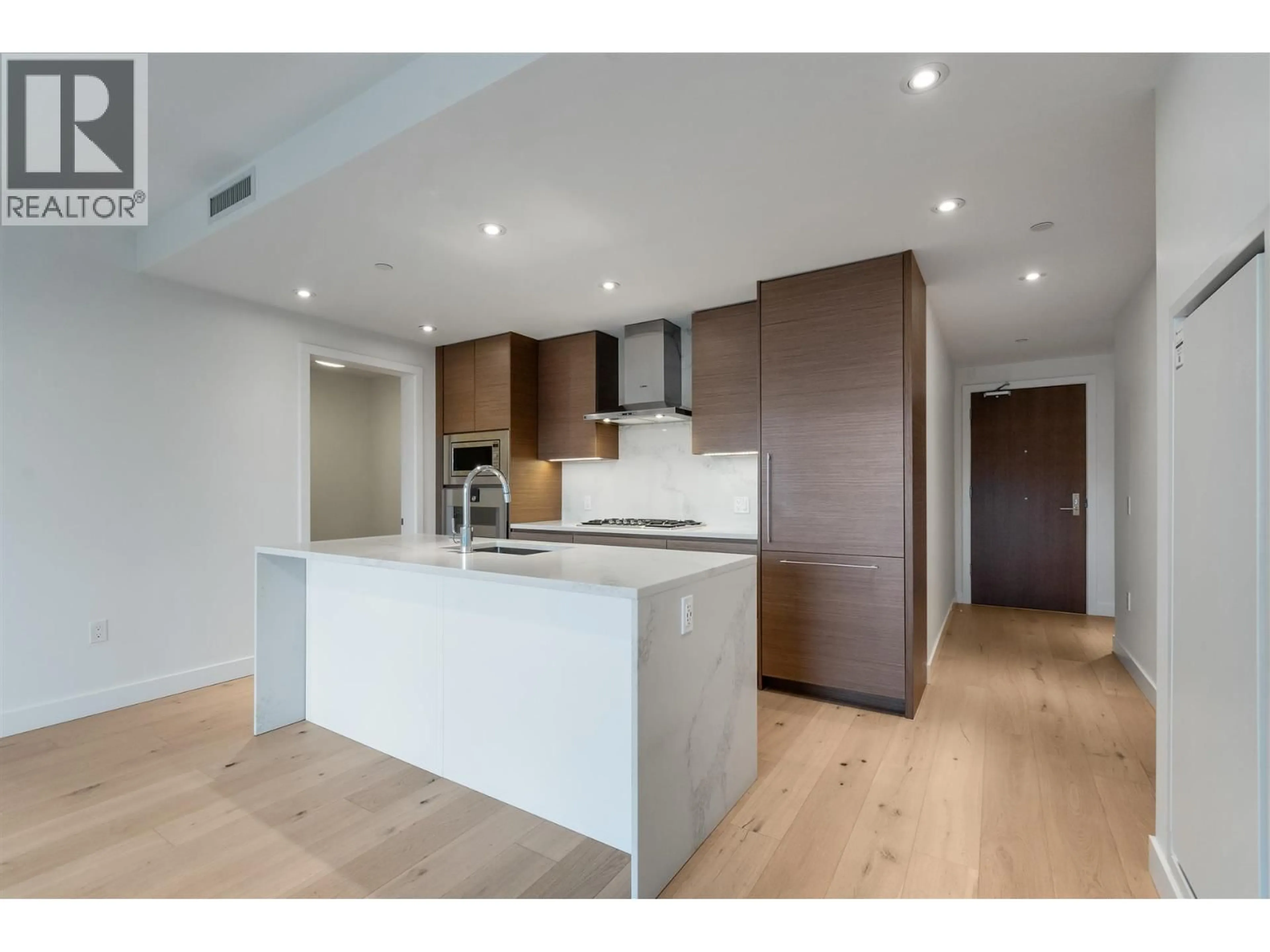 Open concept kitchen, wood/laminate floor for 207 - 5693 ELIZABETH STREET, Vancouver British Columbia V5Y3K1
