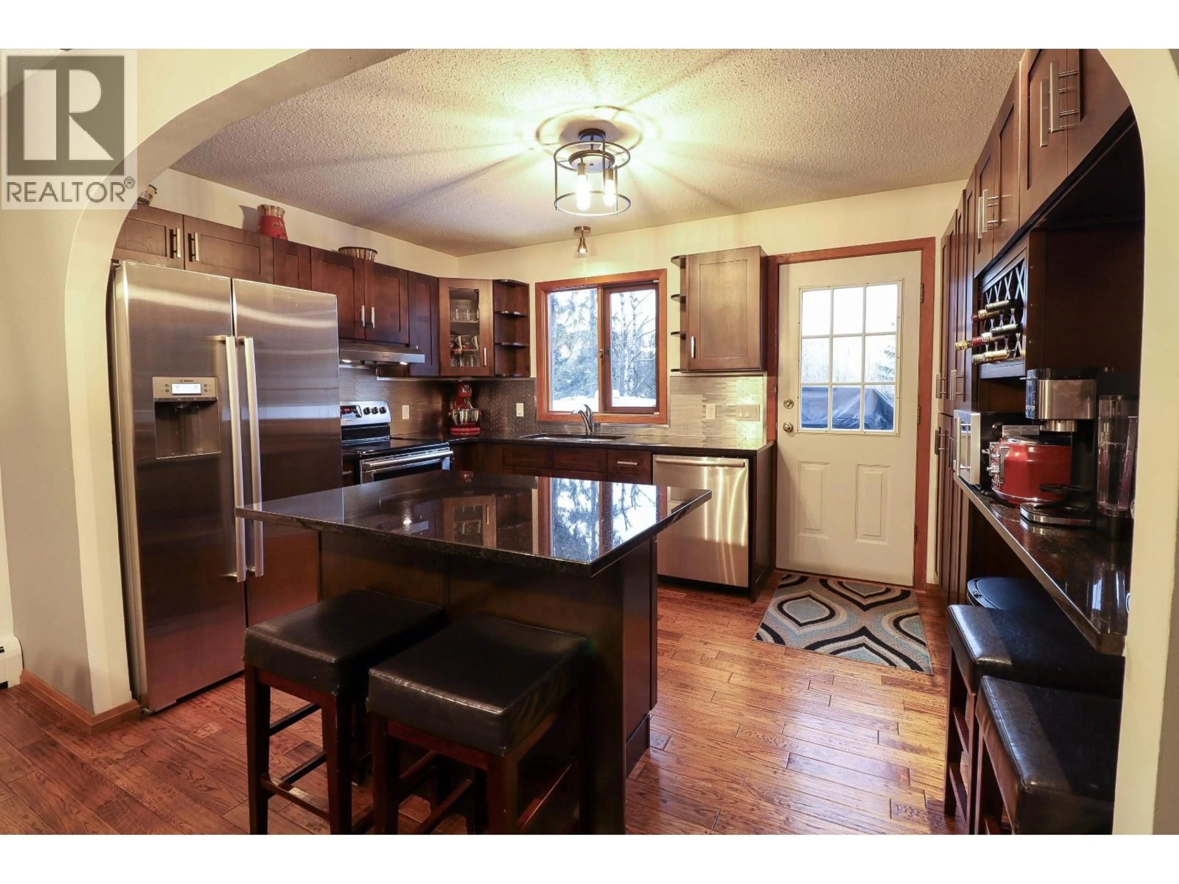 Open concept kitchen, wood/laminate floor for 2598 MCGILL CRESCENT, Prince George British Columbia V2N1Z6