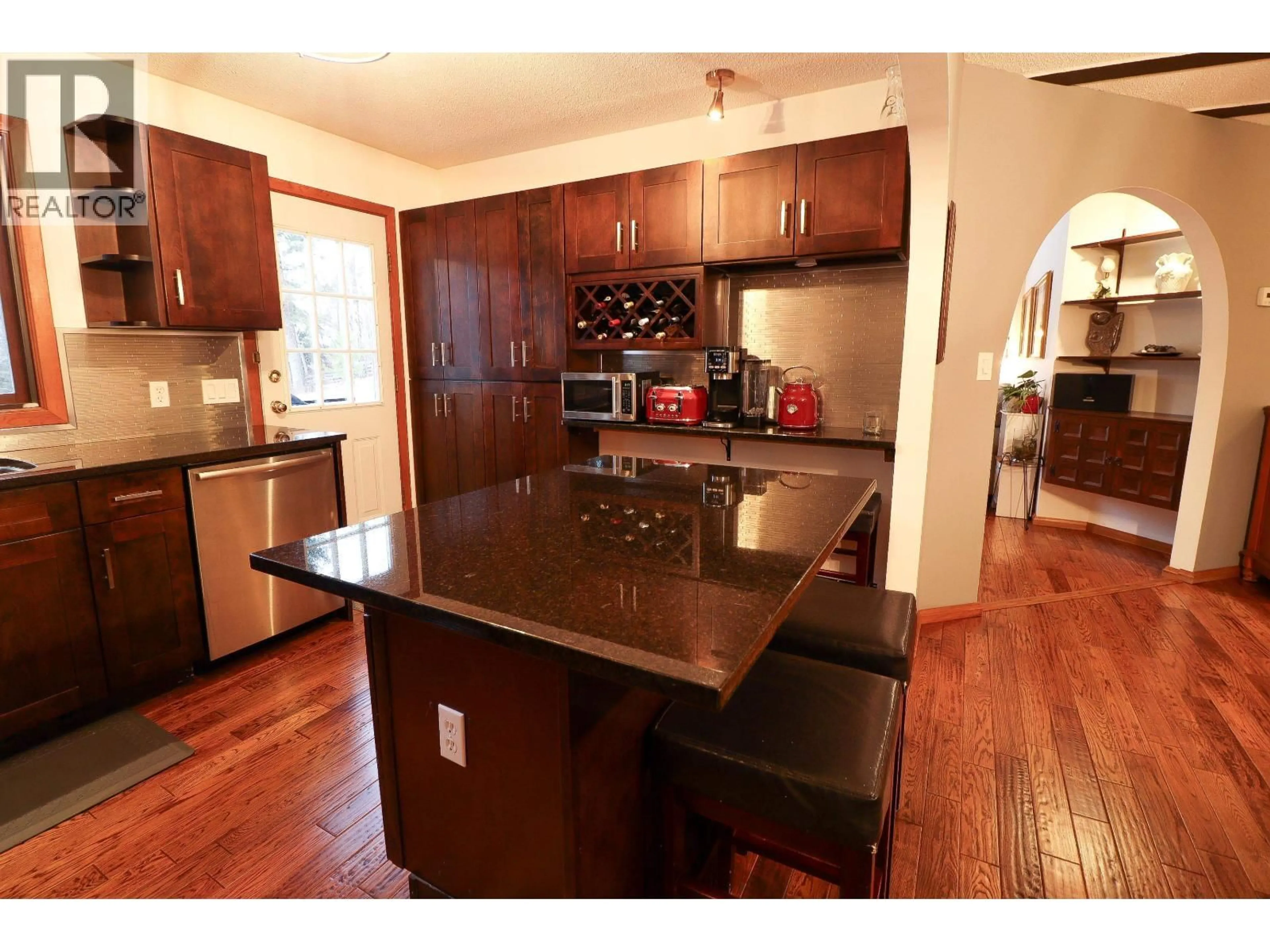 Open concept kitchen, wood/laminate floor for 2598 MCGILL CRESCENT, Prince George British Columbia V2N1Z6