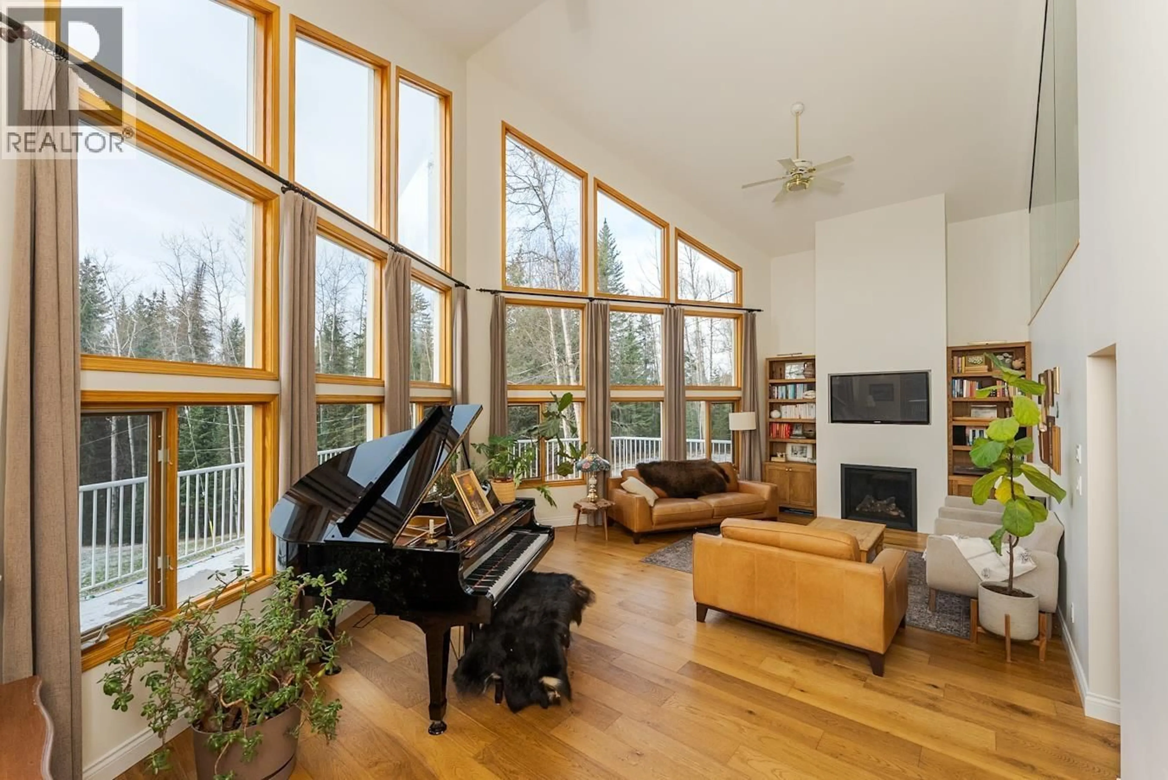 Living room with furniture, wood/laminate floor for 23830 WEST LAKE ROAD, Prince George British Columbia V2N6H6