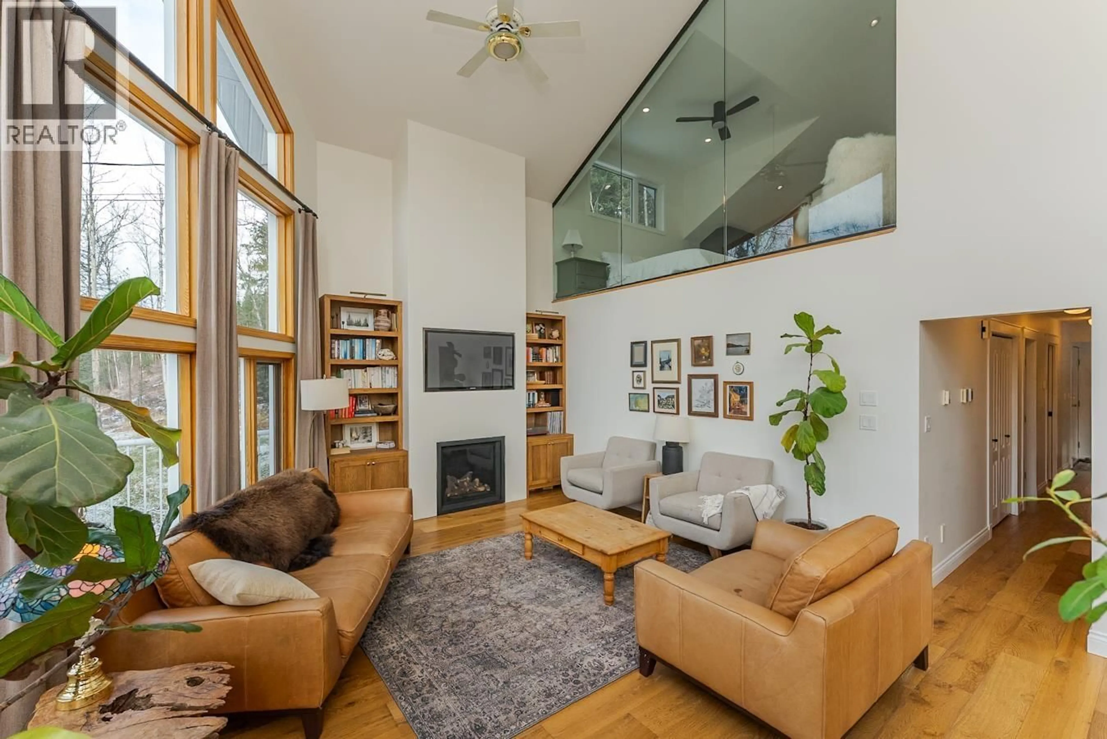 Living room with furniture, wood/laminate floor for 23830 WEST LAKE ROAD, Prince George British Columbia V2N6H6