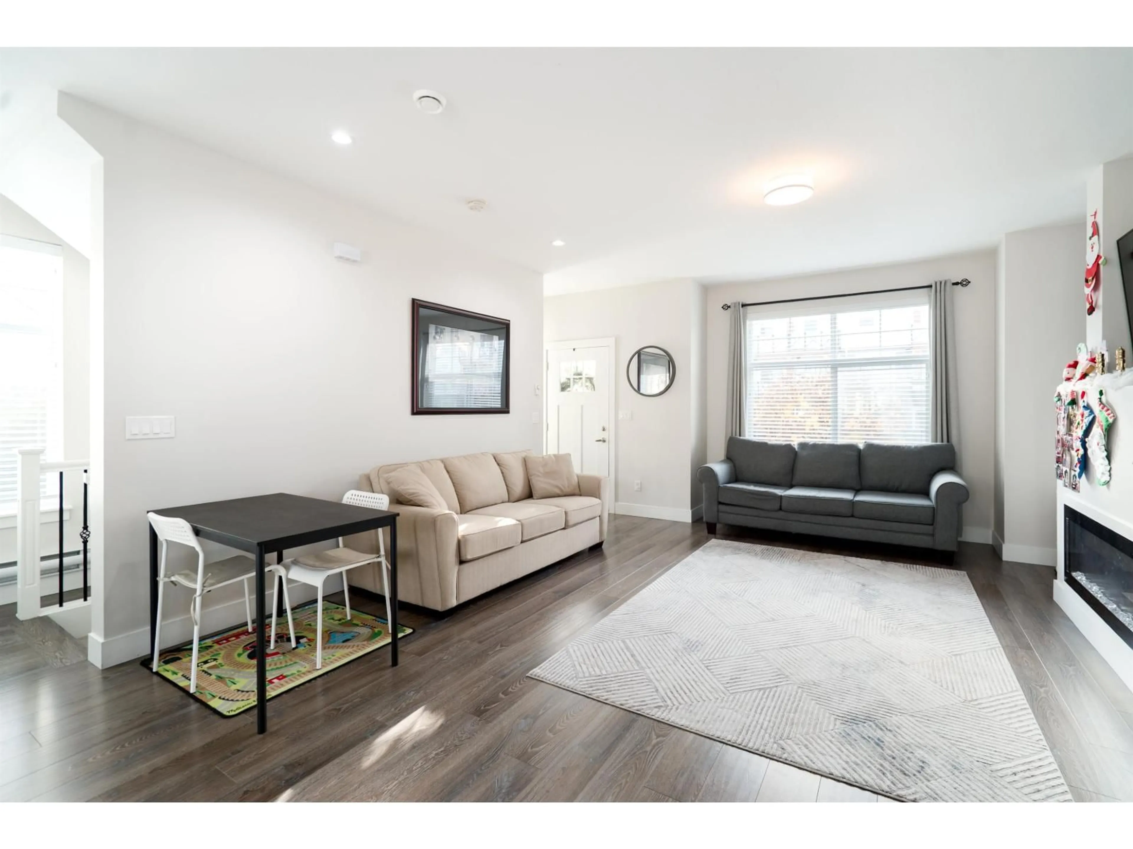 Living room with furniture, wood/laminate floor for 57 - 14541 WINTER CRESCENT, Surrey British Columbia V4P0G5