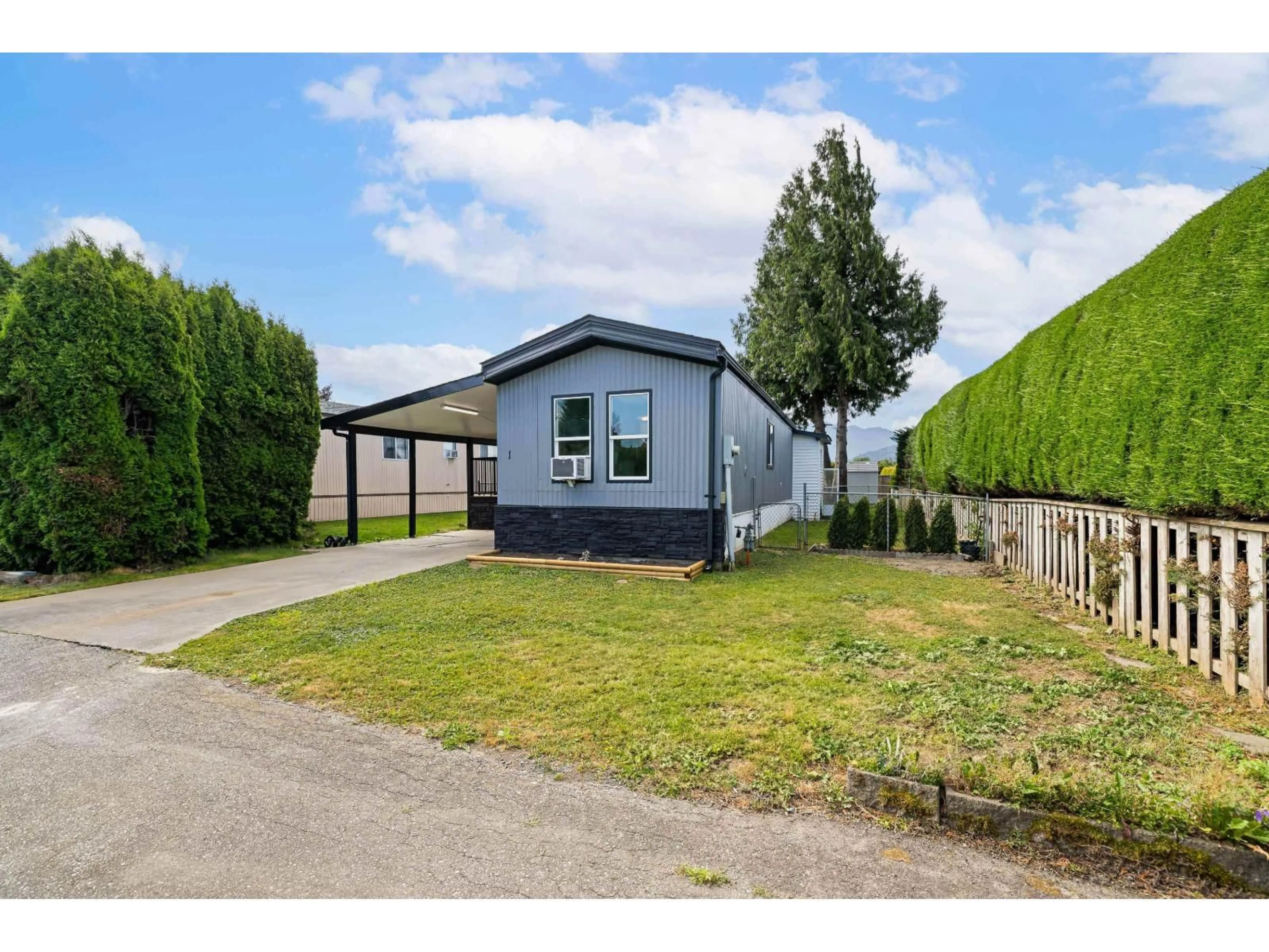 A pic from outside/outdoor area/front of a property/back of a property/a pic from drone, street for 1 - 7610 EVANS ROAD, Chilliwack British Columbia V2R2T4