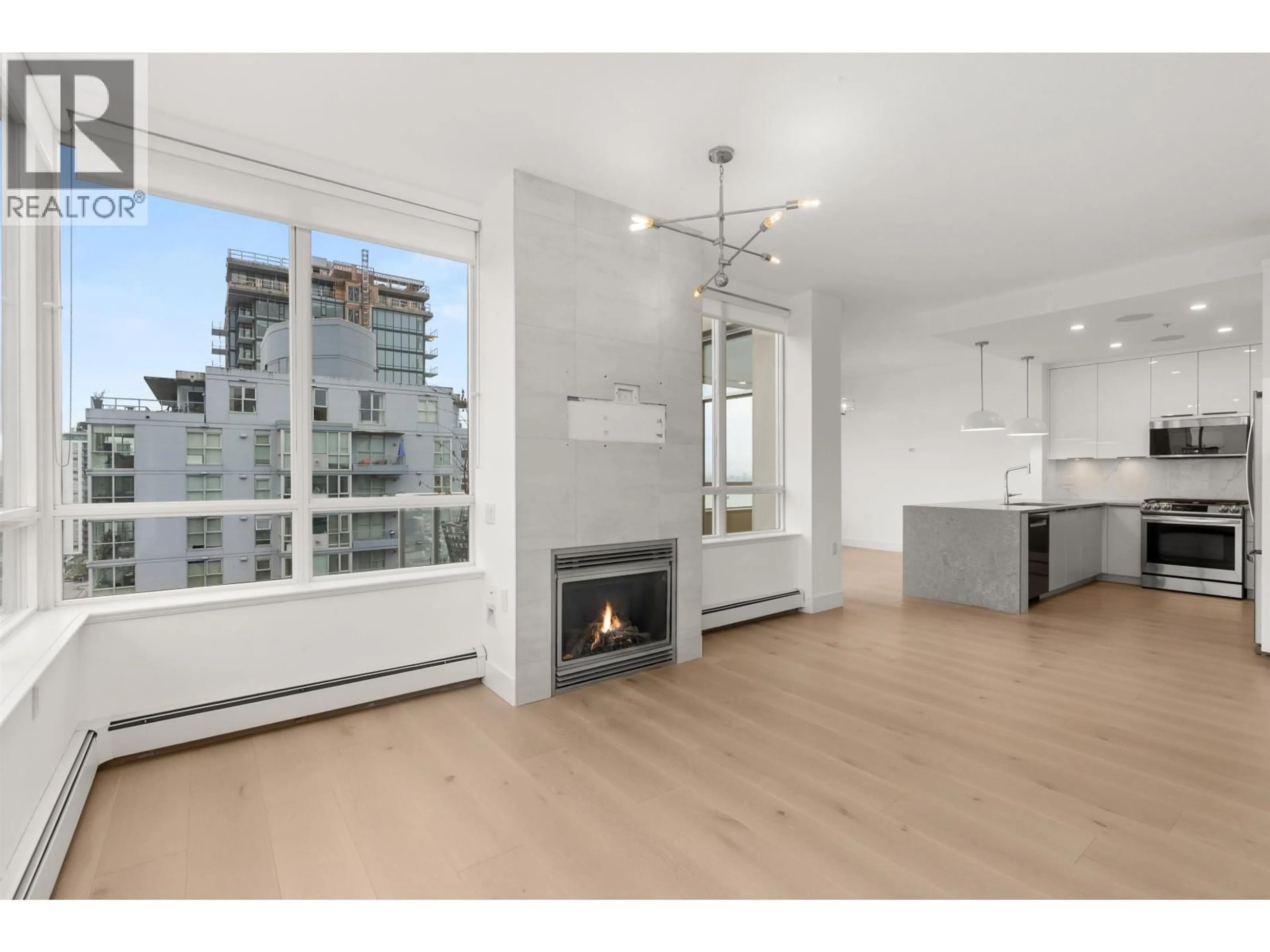 Open concept kitchen, wood/laminate floor for 1404 - 120 16TH STREET, North Vancouver British Columbia V7M3N6