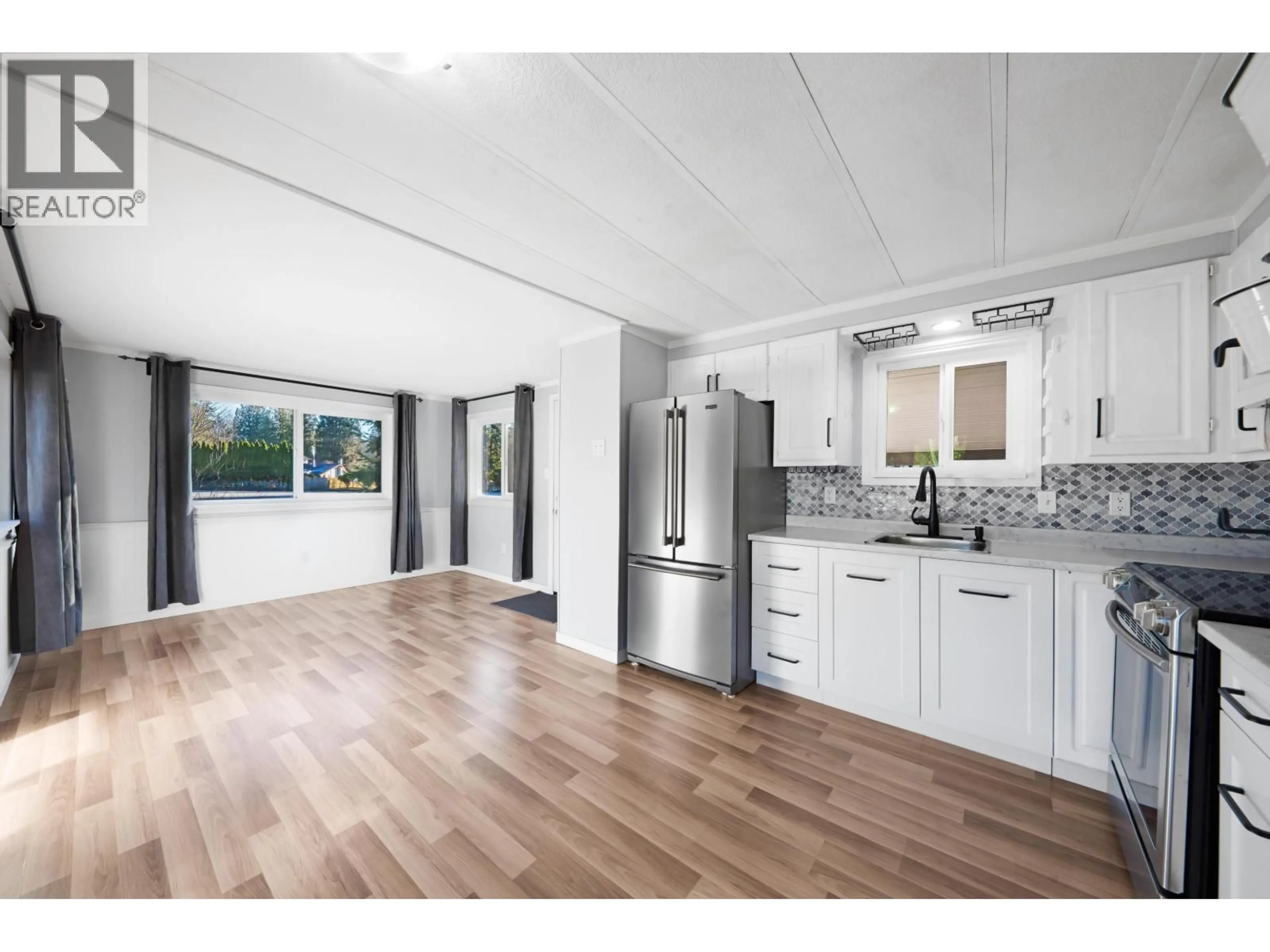 Open concept kitchen, wood/laminate floor for 23206 CALVIN CRESCENT, Maple Ridge British Columbia V2X4S3