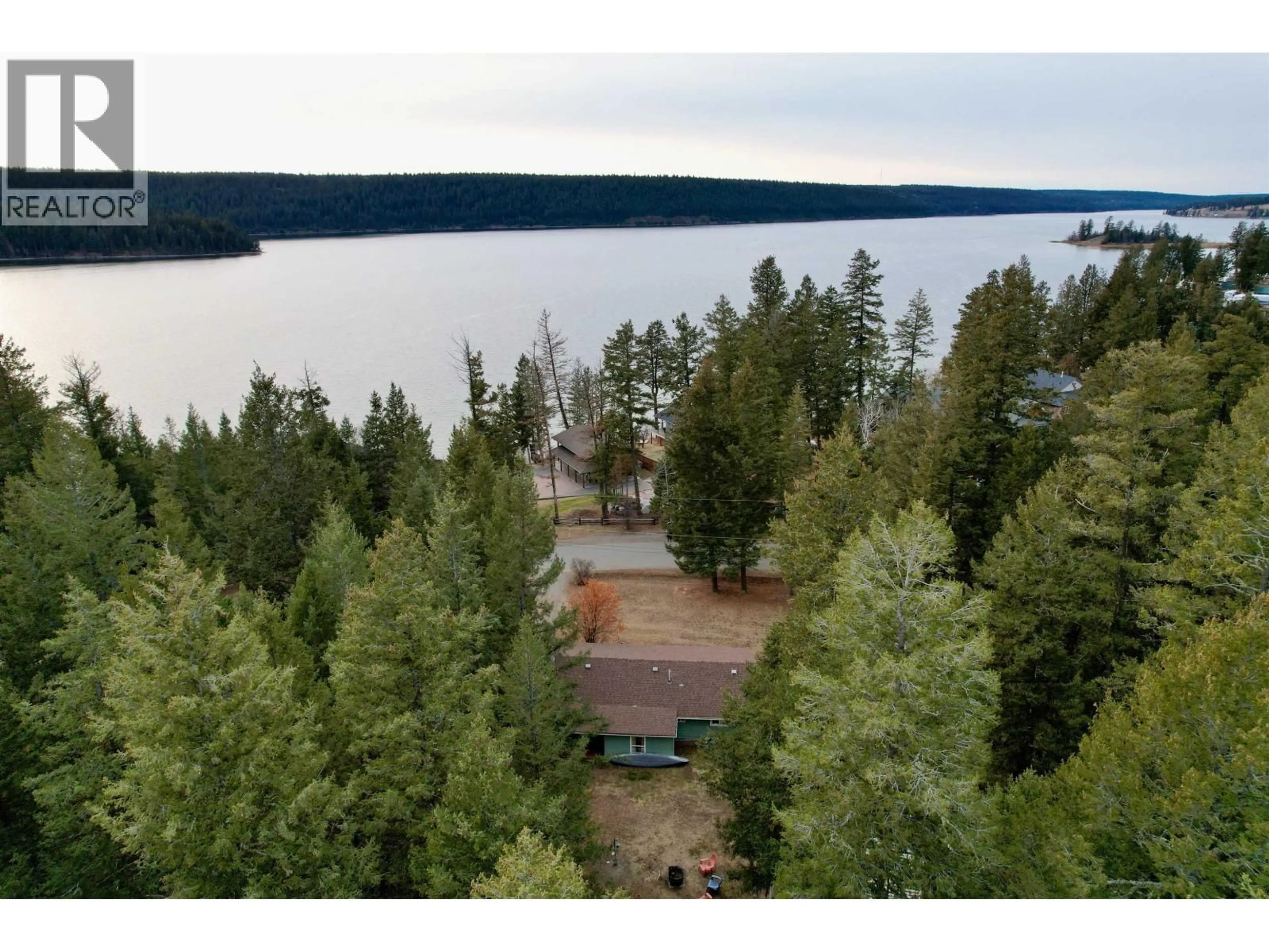 A pic from outside/outdoor area/front of a property/back of a property/a pic from drone, water/lake/river/ocean view for 3743 EMERALD CRESCENT, Lac La Hache British Columbia V0K1T0