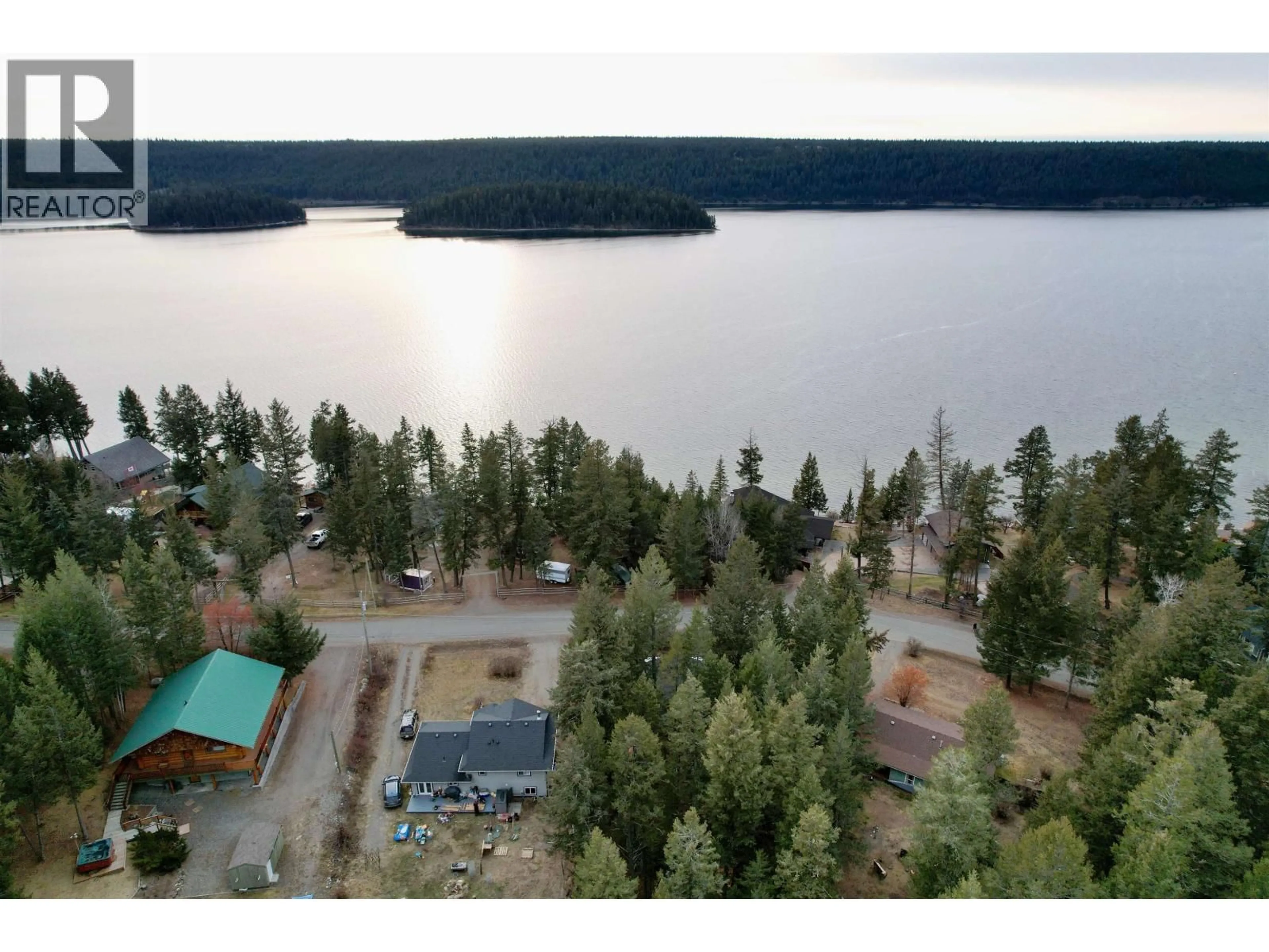 A pic from outside/outdoor area/front of a property/back of a property/a pic from drone, water/lake/river/ocean view for 3743 EMERALD CRESCENT, Lac La Hache British Columbia V0K1T0