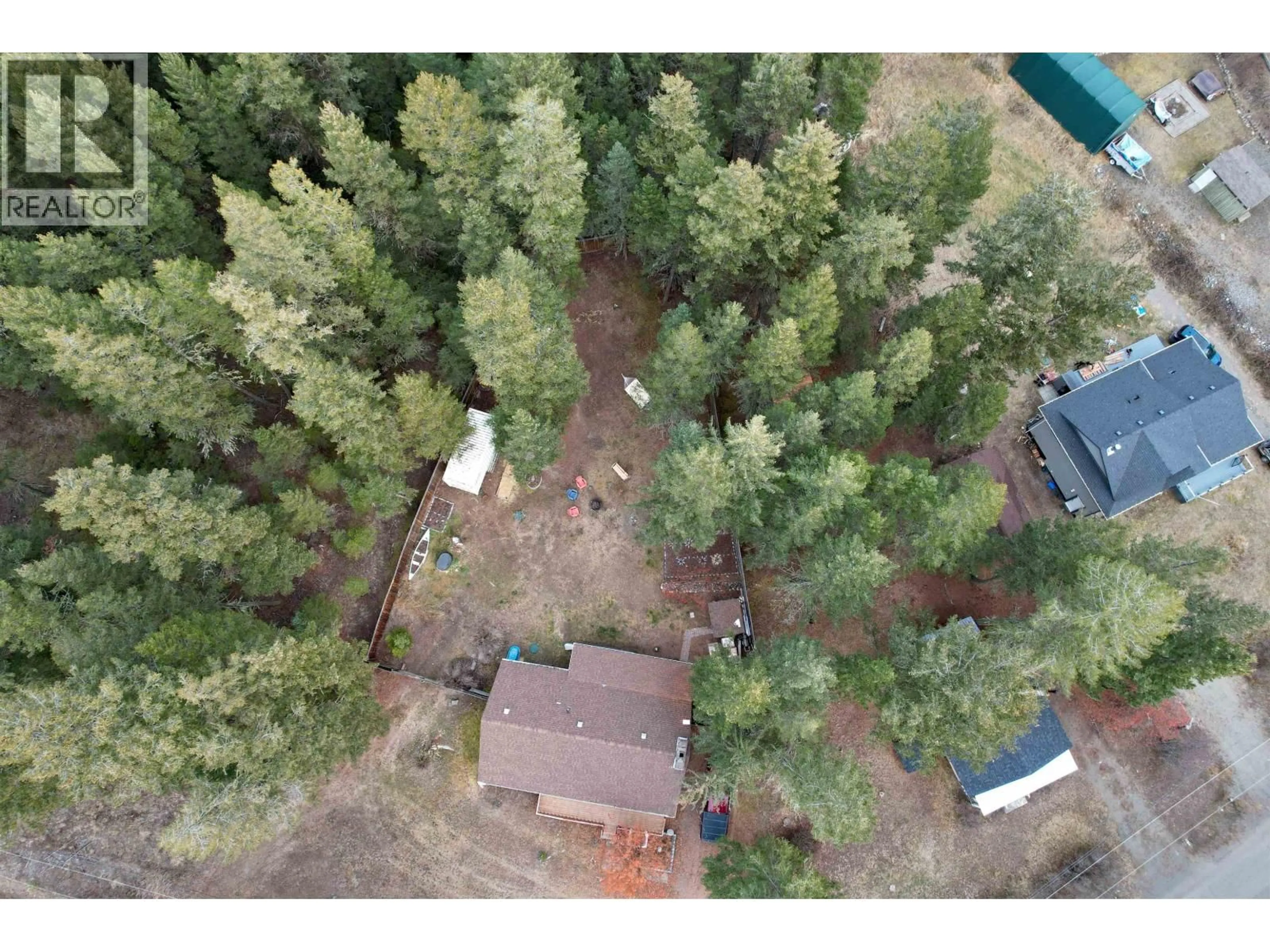 A pic from outside/outdoor area/front of a property/back of a property/a pic from drone, forest/trees view for 3743 EMERALD CRESCENT, Lac La Hache British Columbia V0K1T0