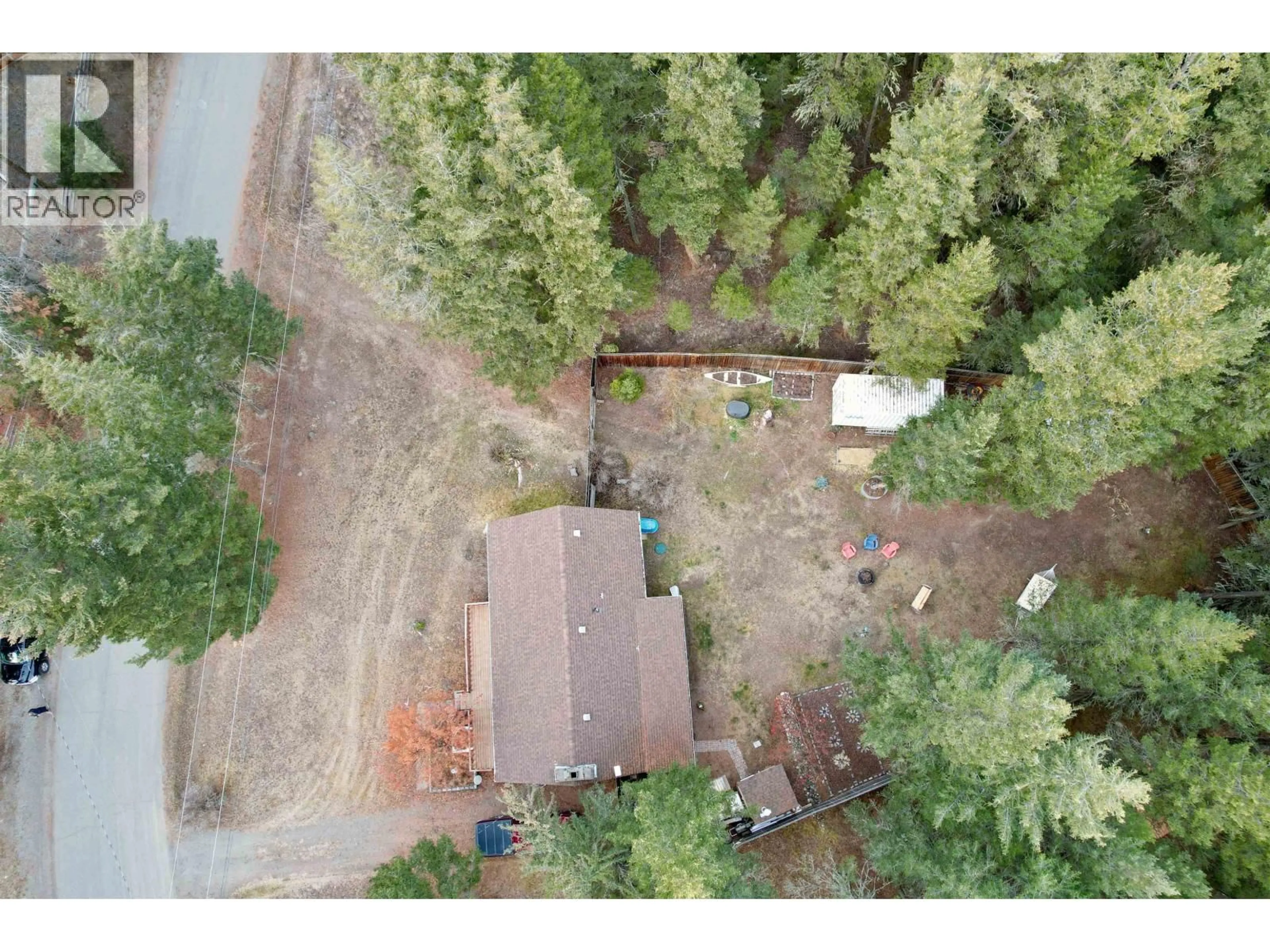 A pic from outside/outdoor area/front of a property/back of a property/a pic from drone, forest/trees view for 3743 EMERALD CRESCENT, Lac La Hache British Columbia V0K1T0