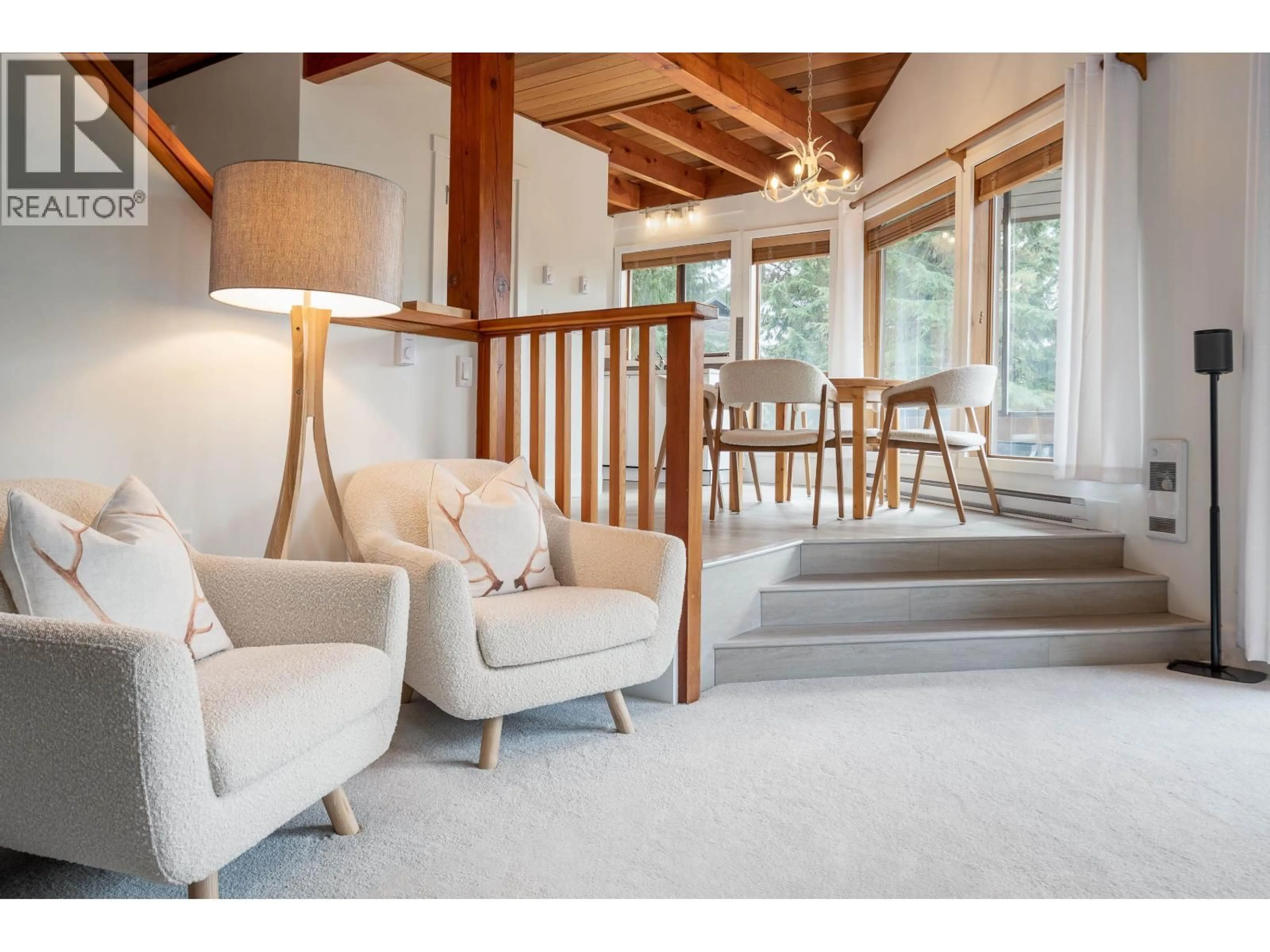 Living room with furniture, wood/laminate floor for 206 - 6117 EAGLE DRIVE, Whistler British Columbia V0N1B6