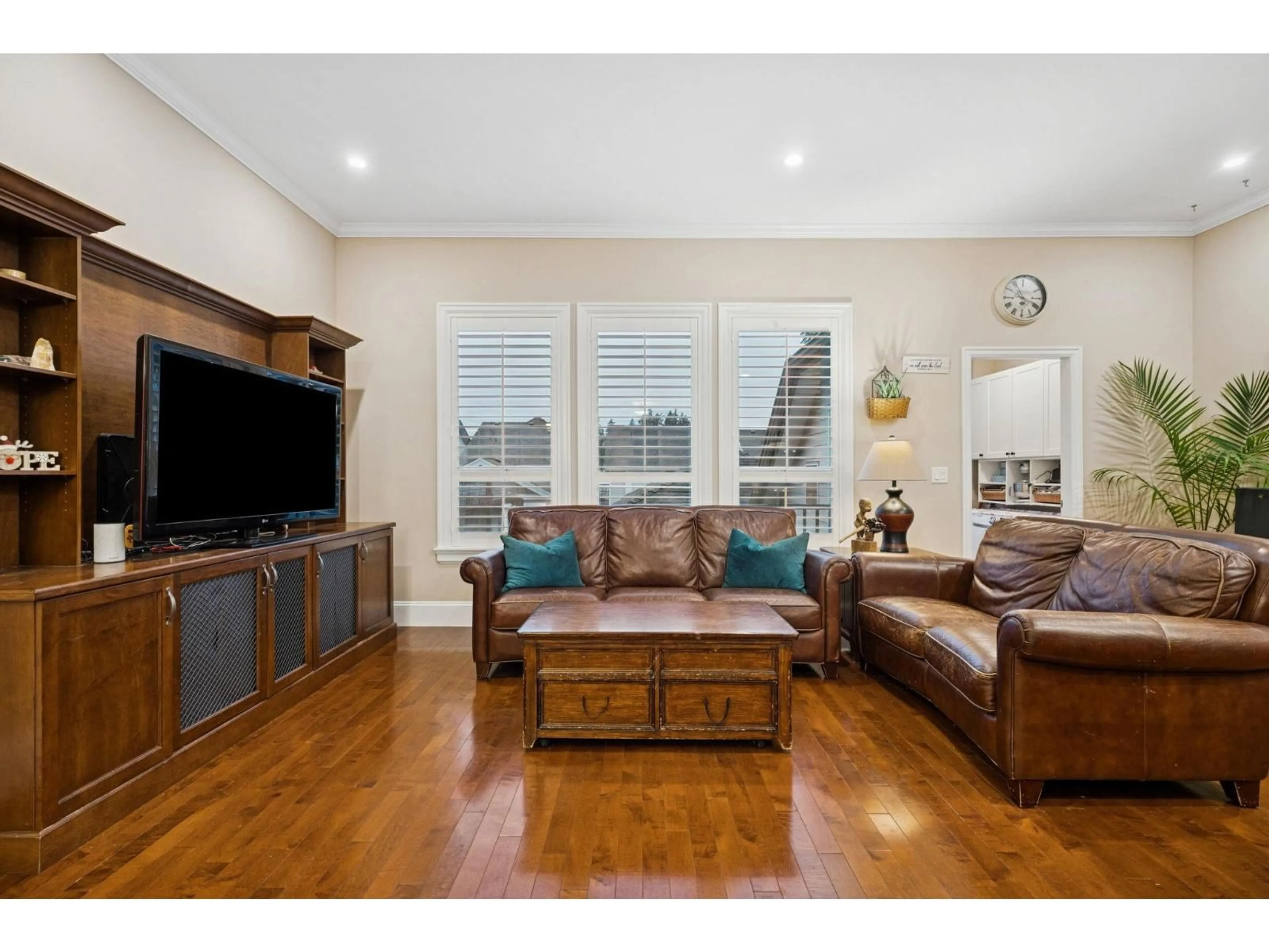 Living room with furniture, wood/laminate floor for 3467 148A STREET, Surrey British Columbia V4P0B9