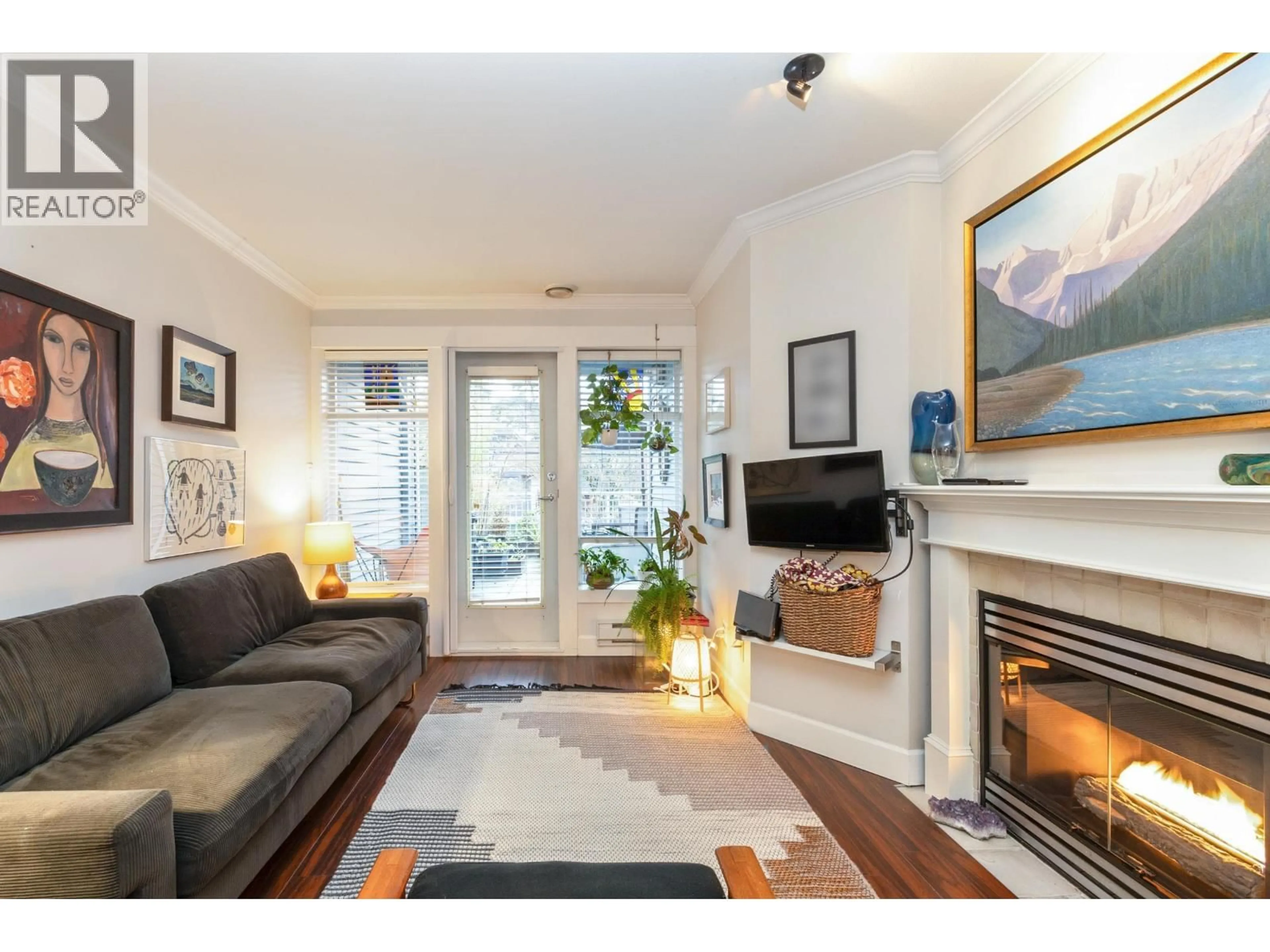 Living room with furniture, wood/laminate floor for 209 - 3333 4TH AVENUE, Vancouver British Columbia V6R4R9