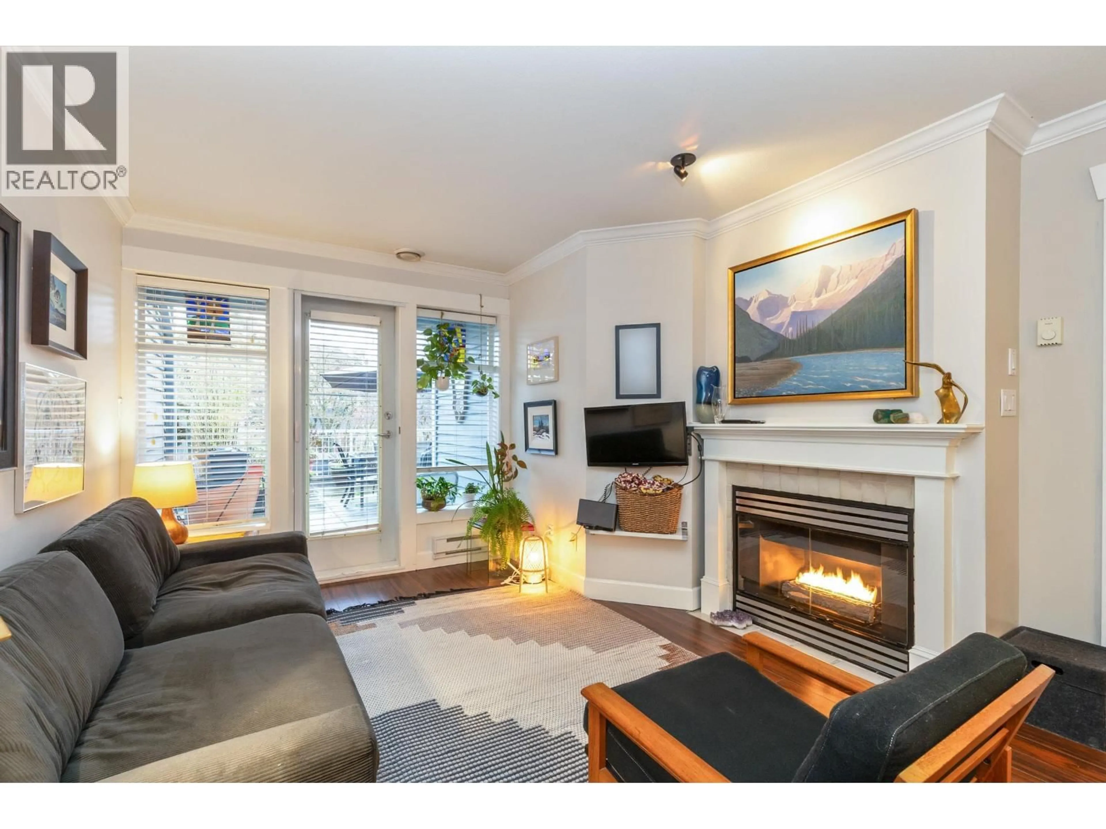 Living room with furniture, wood/laminate floor for 209 - 3333 4TH AVENUE, Vancouver British Columbia V6R4R9