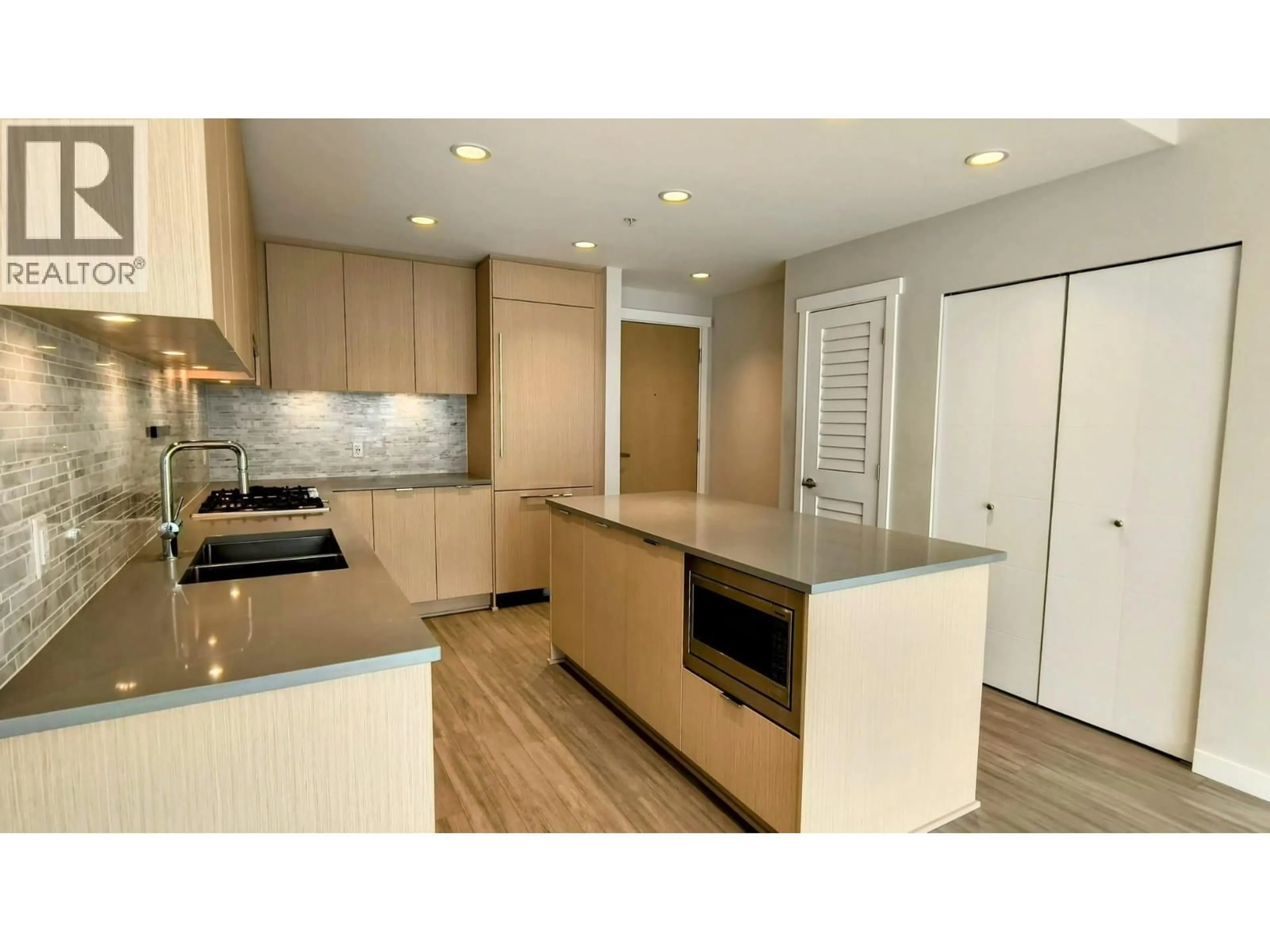 Open concept kitchen, wood/laminate floor for 404 - 9233 ODLIN ROAD, Richmond British Columbia V6X0V4