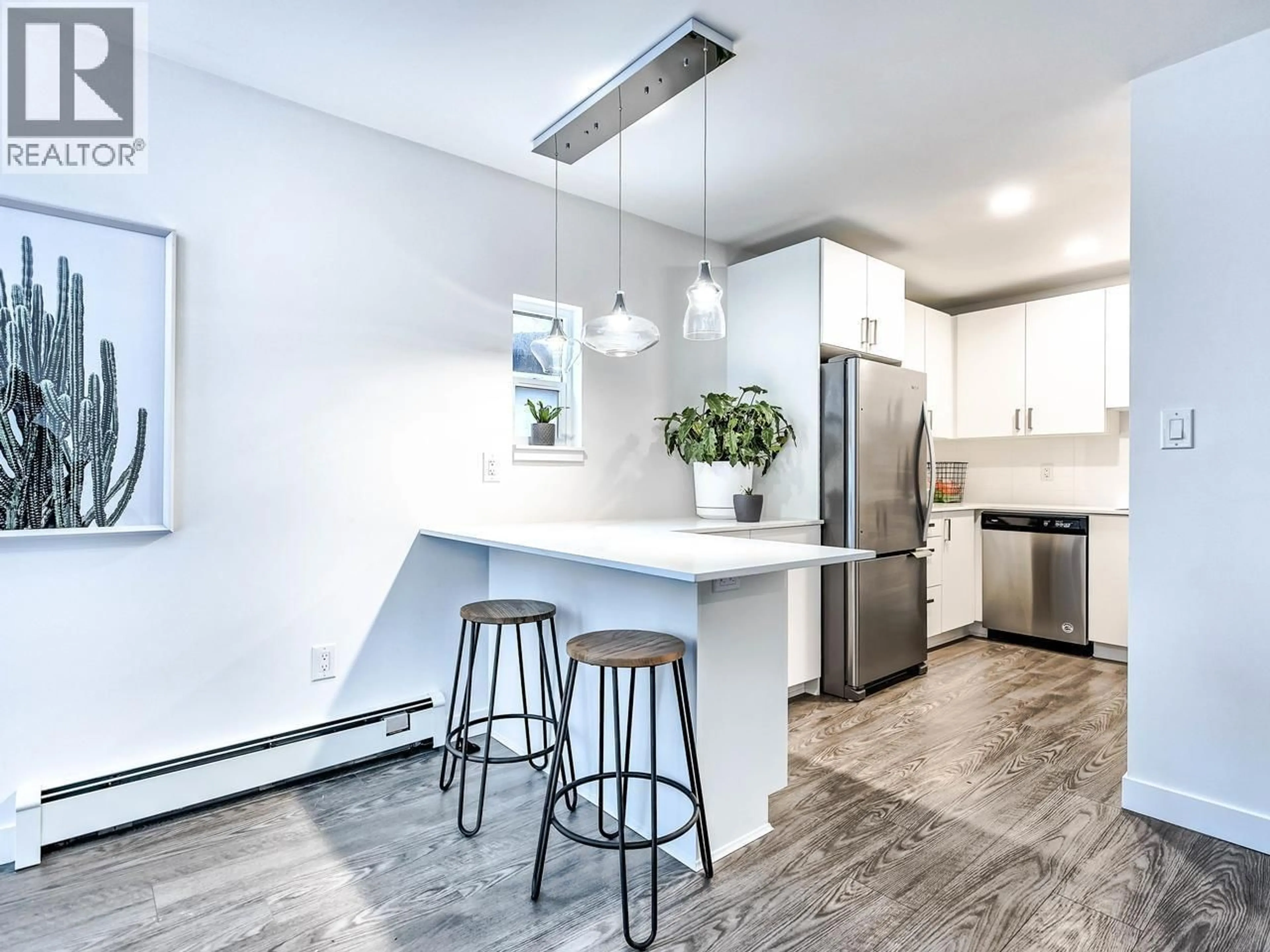 Open concept kitchen, wood/laminate floor for 303 - 4625 GRANGE STREET, Burnaby British Columbia V5H1R1