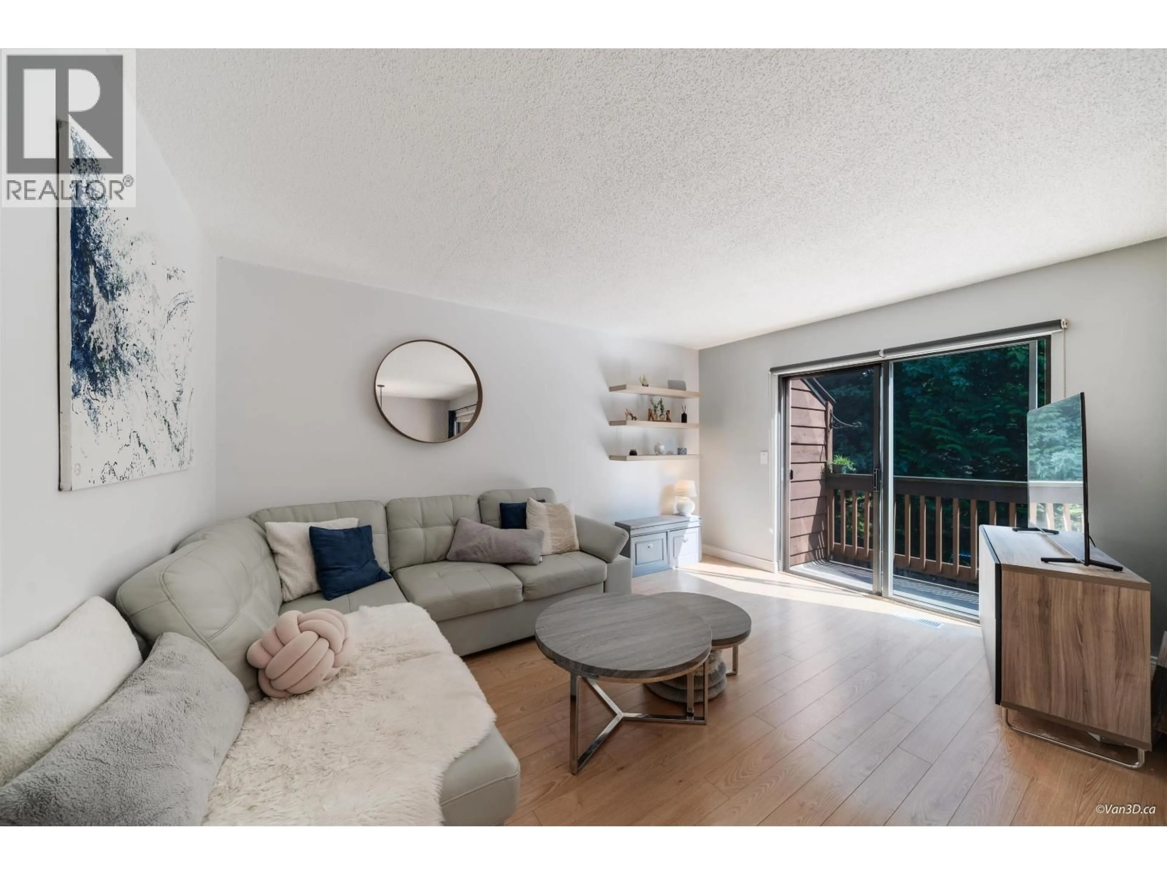 Living room with furniture, wood/laminate floor for 238 CAMBRIDGE WAY, Port Moody British Columbia V3H3W7