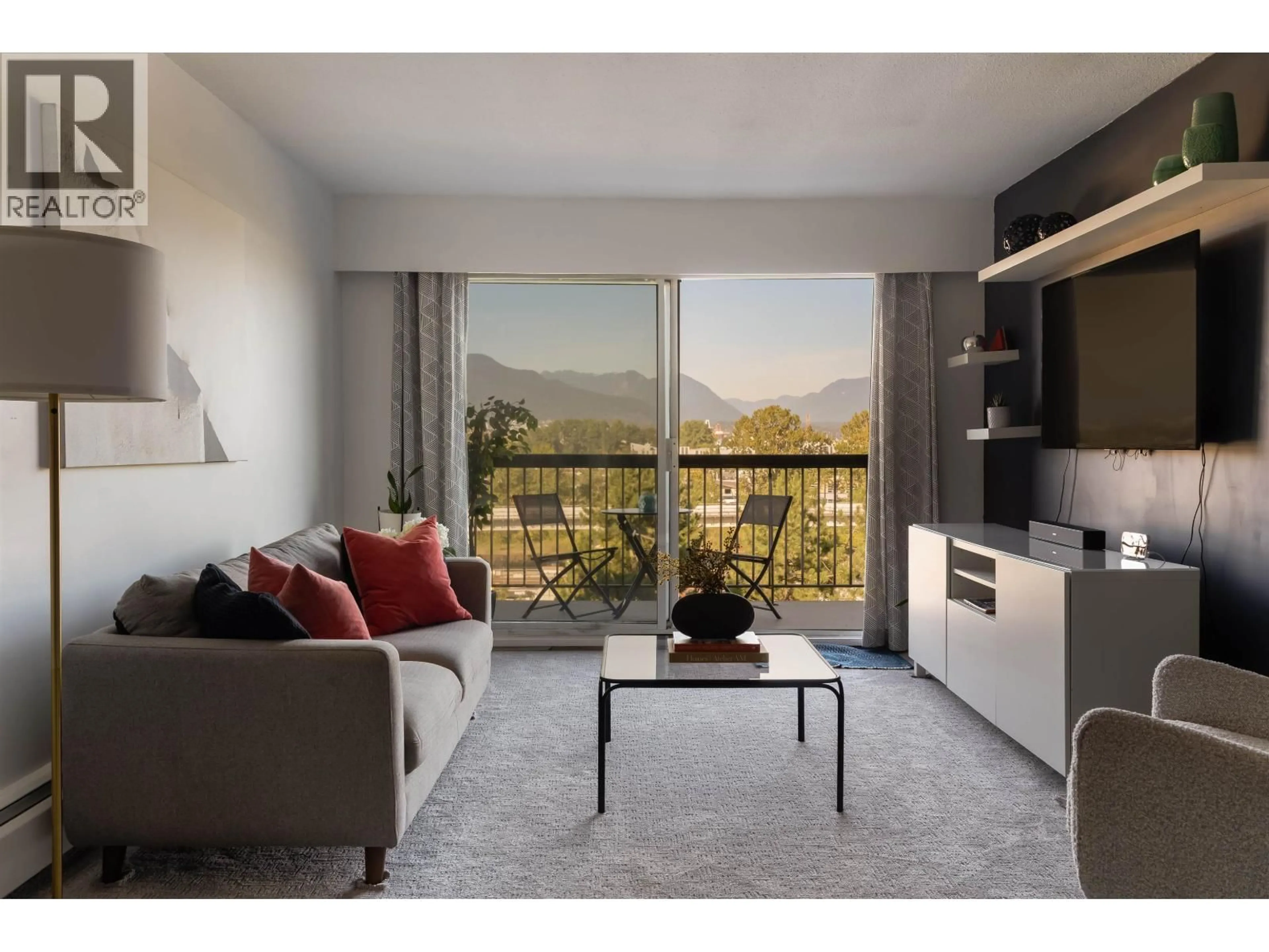 Living room with furniture, wood/laminate floor for 808 - 756 GREAT NORTHERN WAY, Vancouver British Columbia V5T1E4