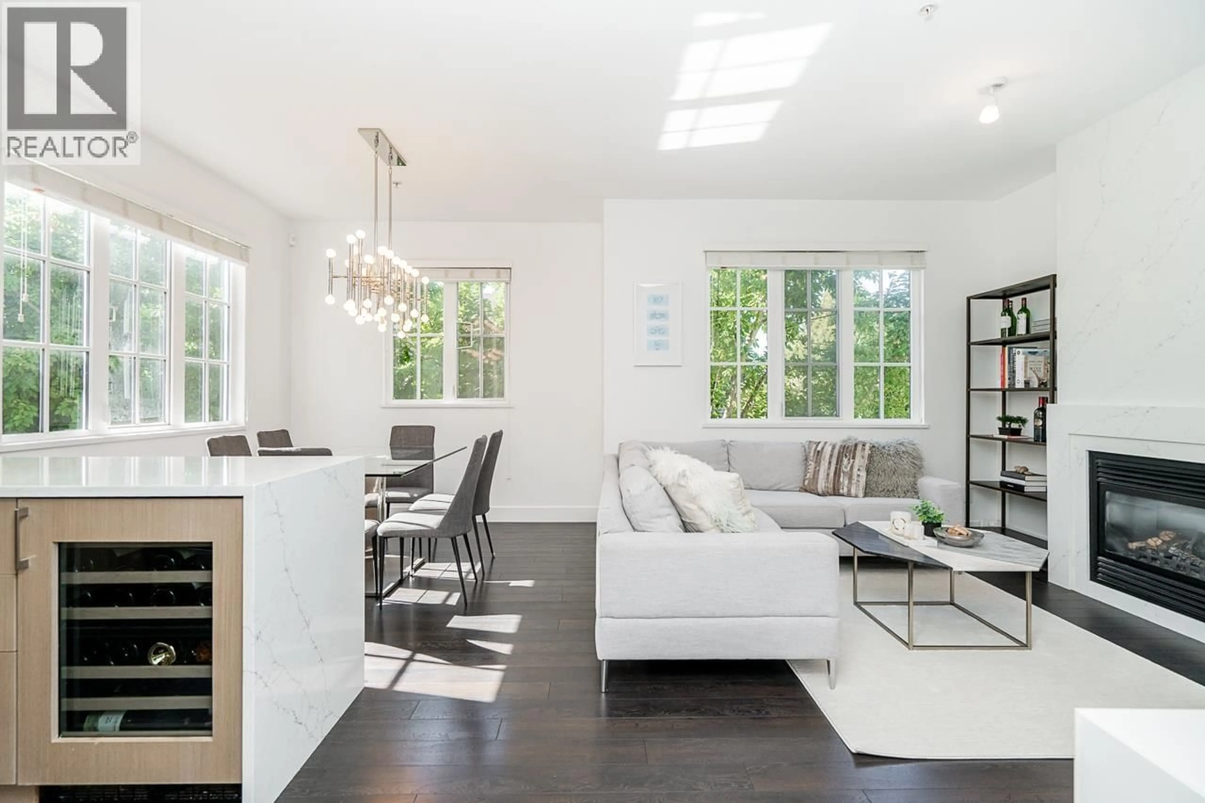 Living room with furniture, wood/laminate floor for 2606 QUEBEC STREET, Vancouver British Columbia V5T3A5