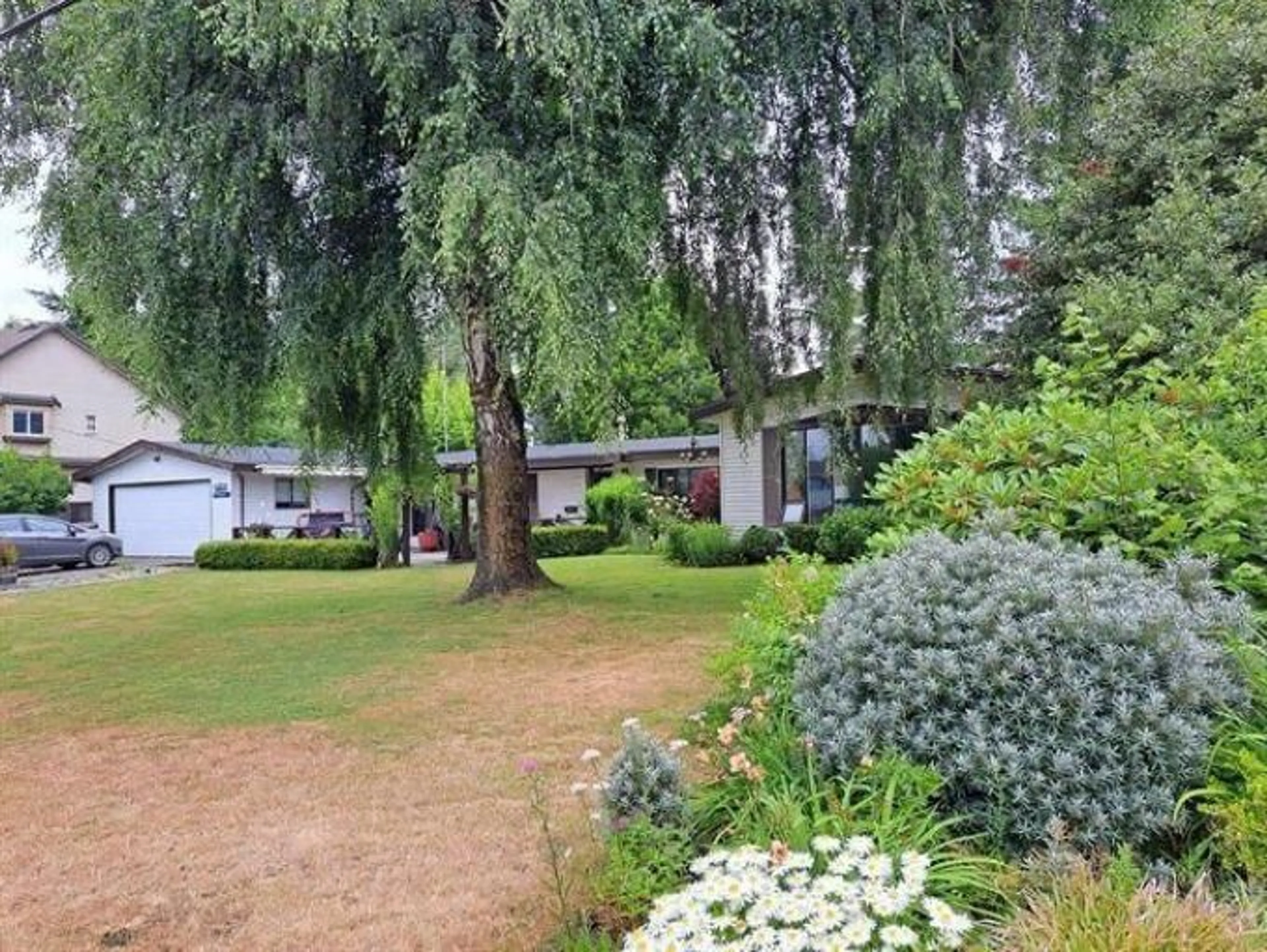 A pic from outside/outdoor area/front of a property/back of a property/a pic from drone, forest/trees view for 26523 28B AVENUE, Langley British Columbia V4W3B1