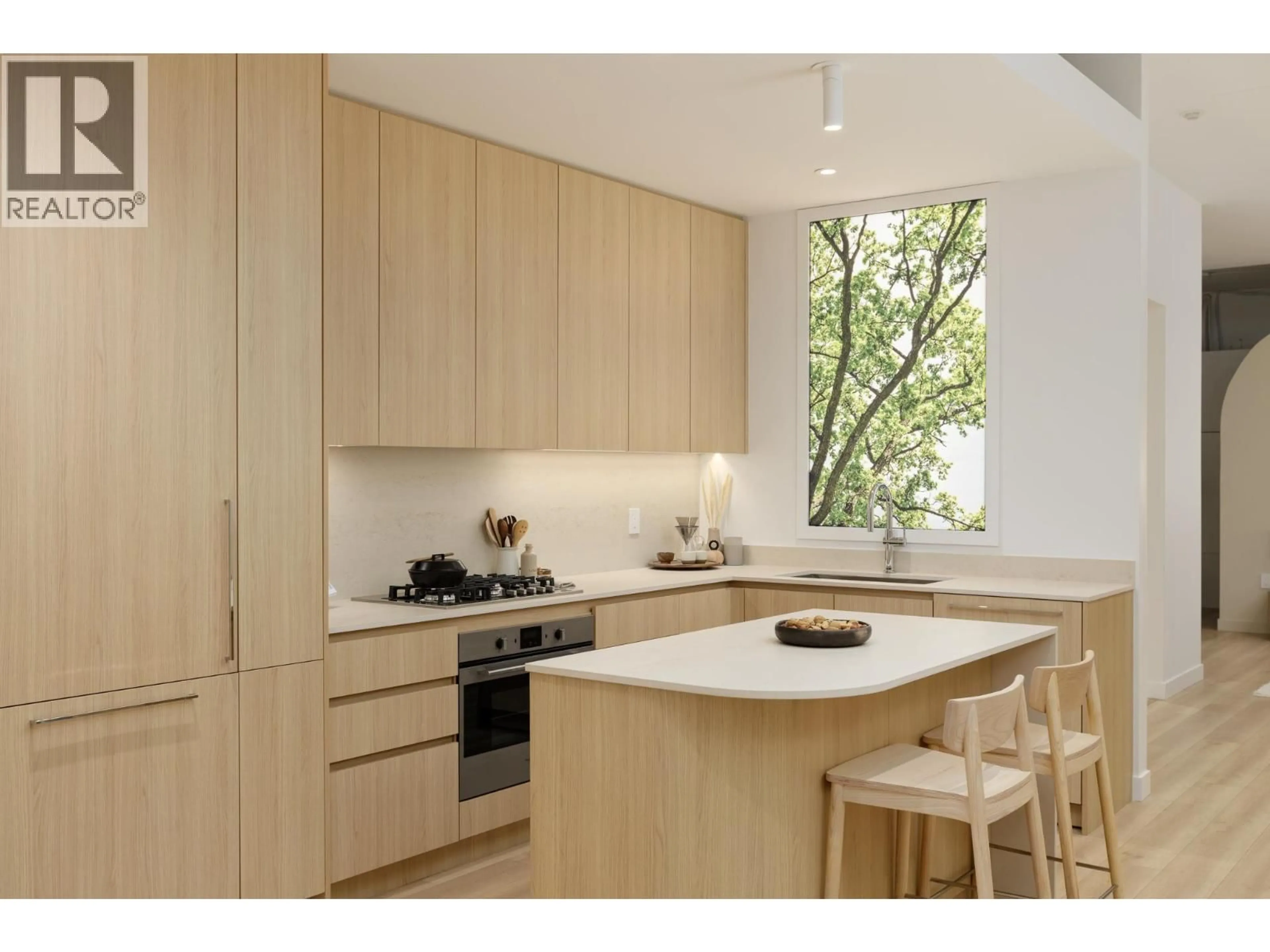 Contemporary kitchen, wood/laminate floor for 104 - 2810 NANAIMO STREET, Vancouver British Columbia V5M2E1