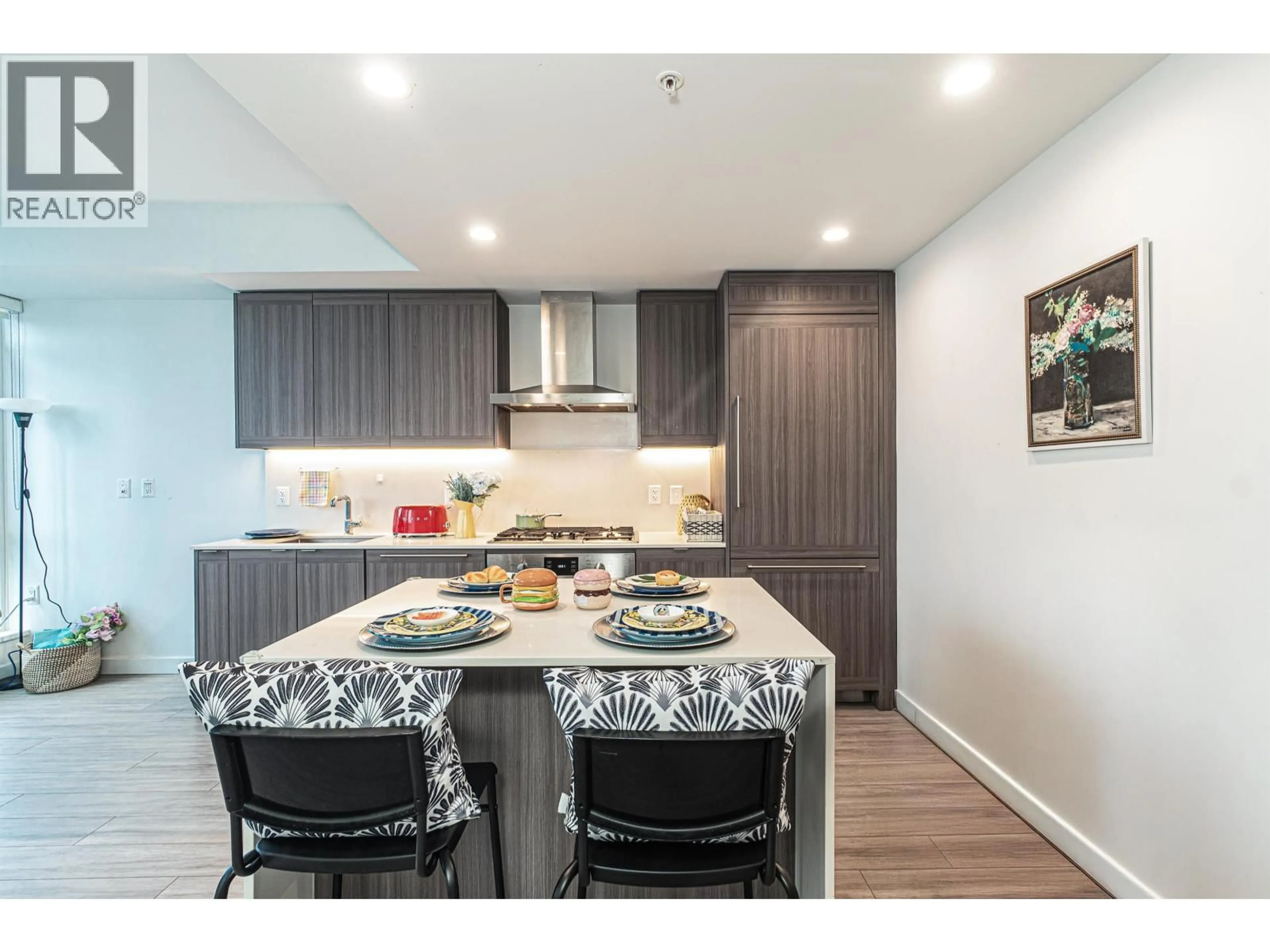 Open concept kitchen, wood/laminate floor for 1607 - 2351 BETA AVENUE, Burnaby British Columbia V5C0M2