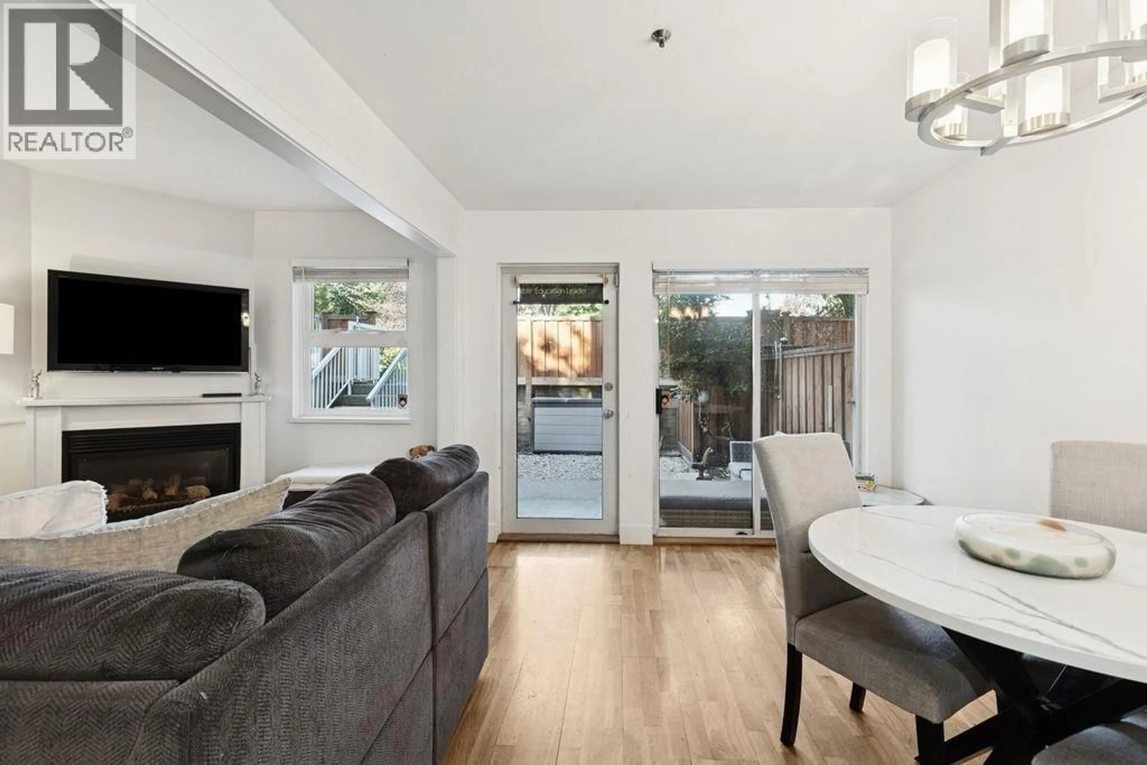 Living room with furniture, wood/laminate floor for 1A - 1048 7TH AVENUE, Vancouver British Columbia V5T1P7