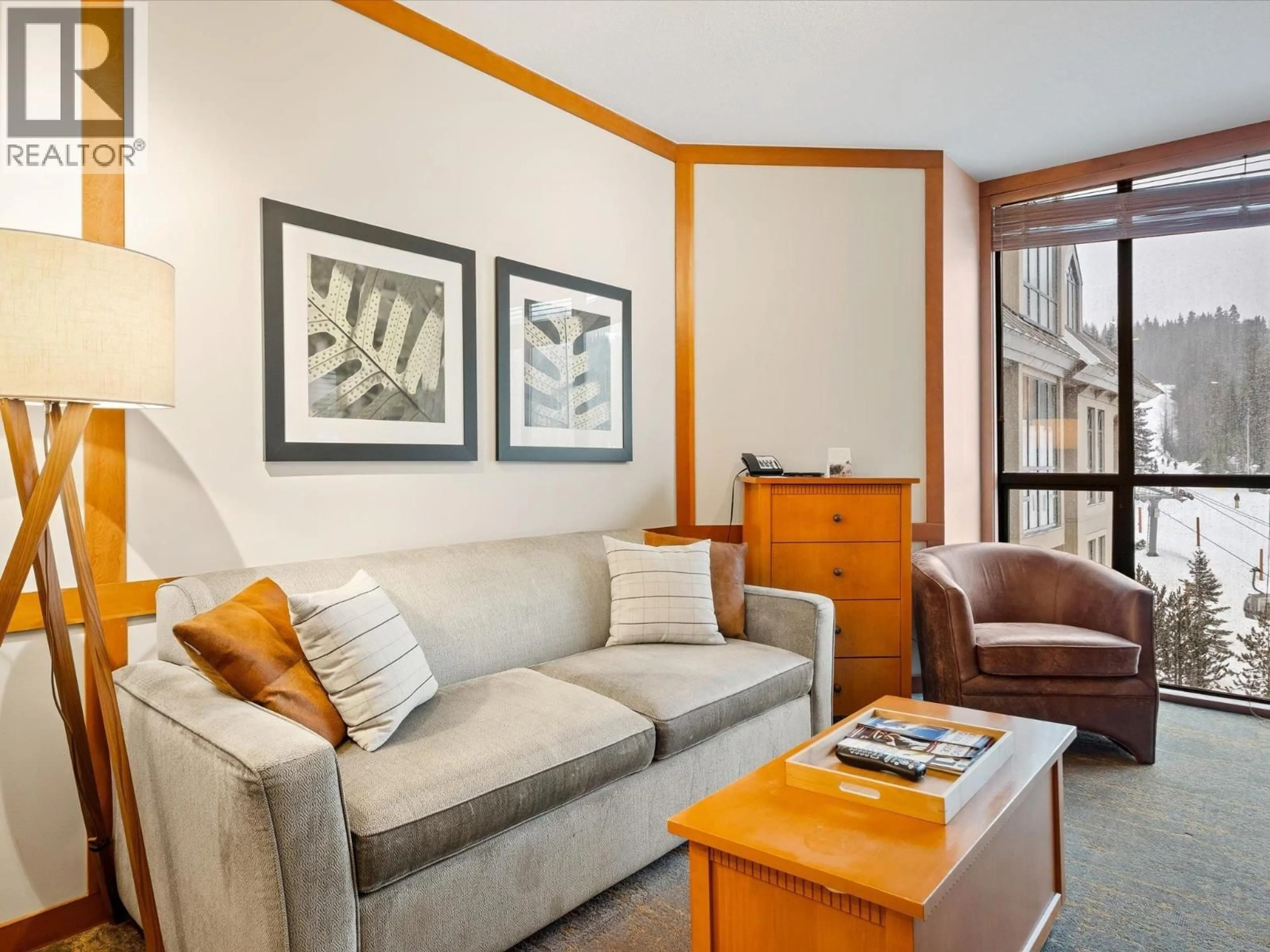 Living room with furniture, wood/laminate floor for 602 - 4320 SUNDIAL CRESCENT, Whistler British Columbia V8E1G6