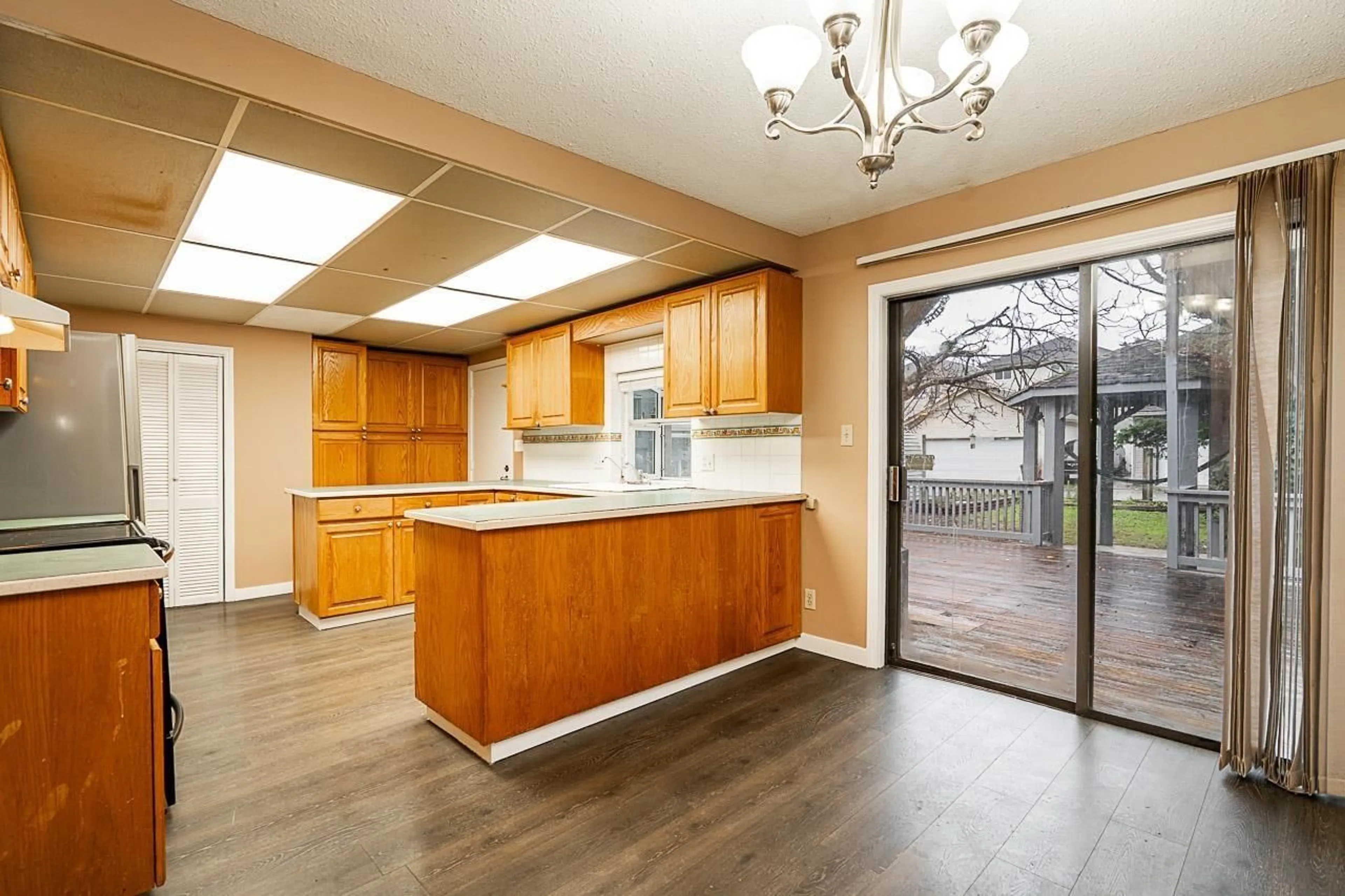 Open concept kitchen, wood/laminate floor for 14720 60 AVENUE, Surrey British Columbia V3S1R7
