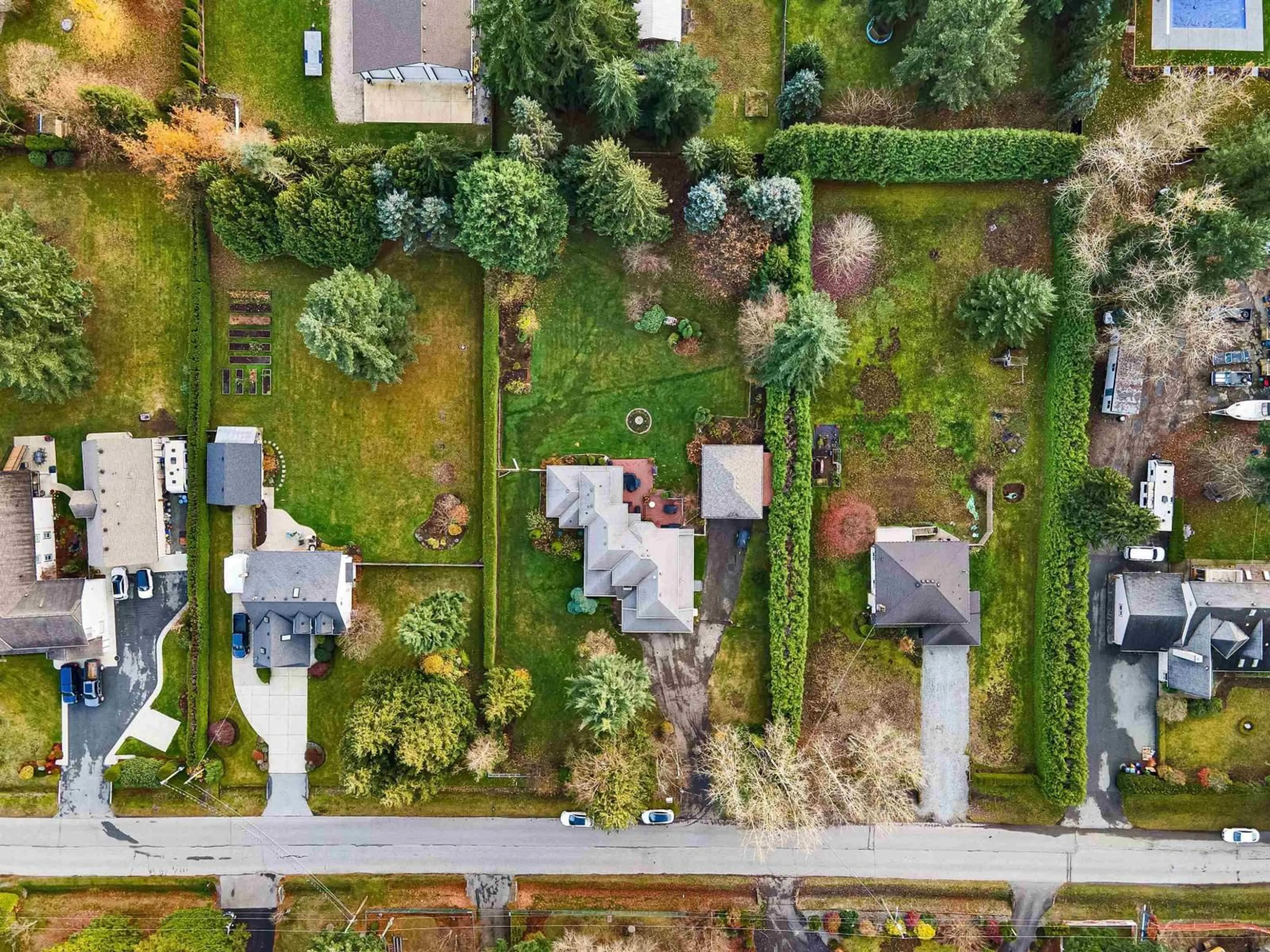 A pic from outside/outdoor area/front of a property/back of a property/a pic from drone, street for 25072 58 AVENUE, Langley British Columbia V4W1T5