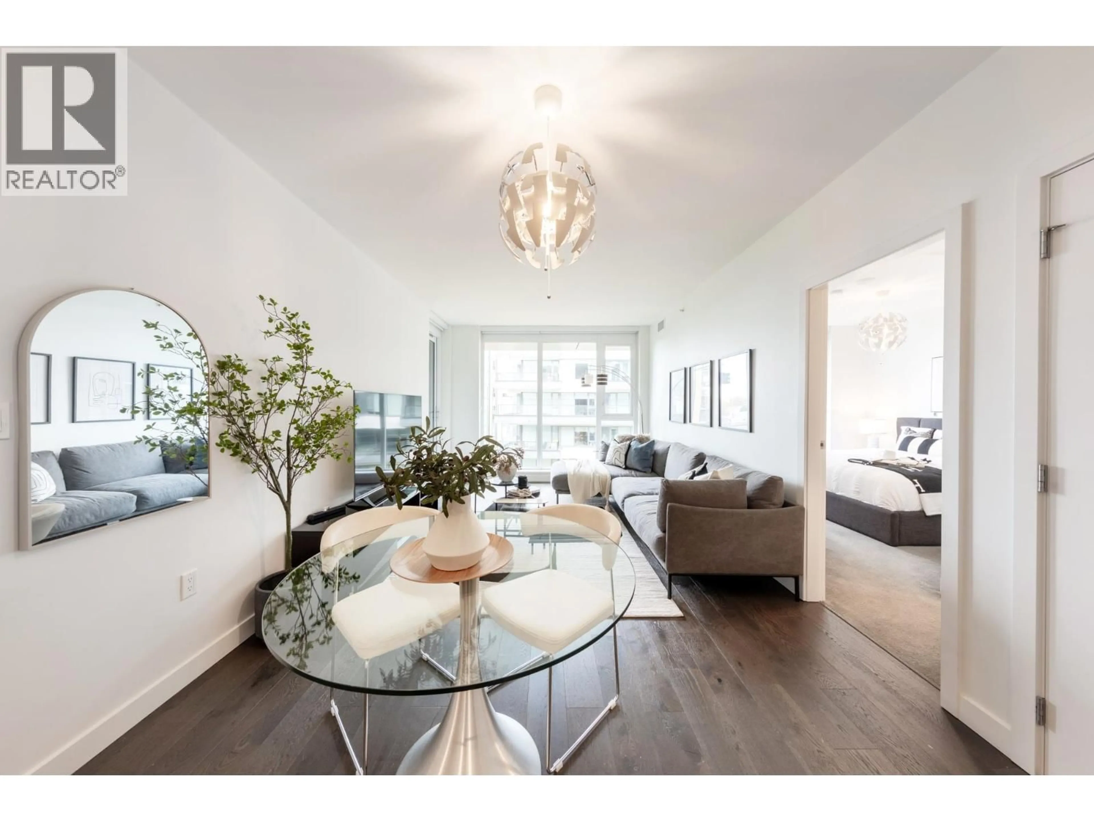 Living room with furniture, wood/laminate floor for 902 - 3331 NO. 3 ROAD, Richmond British Columbia V6X2B6