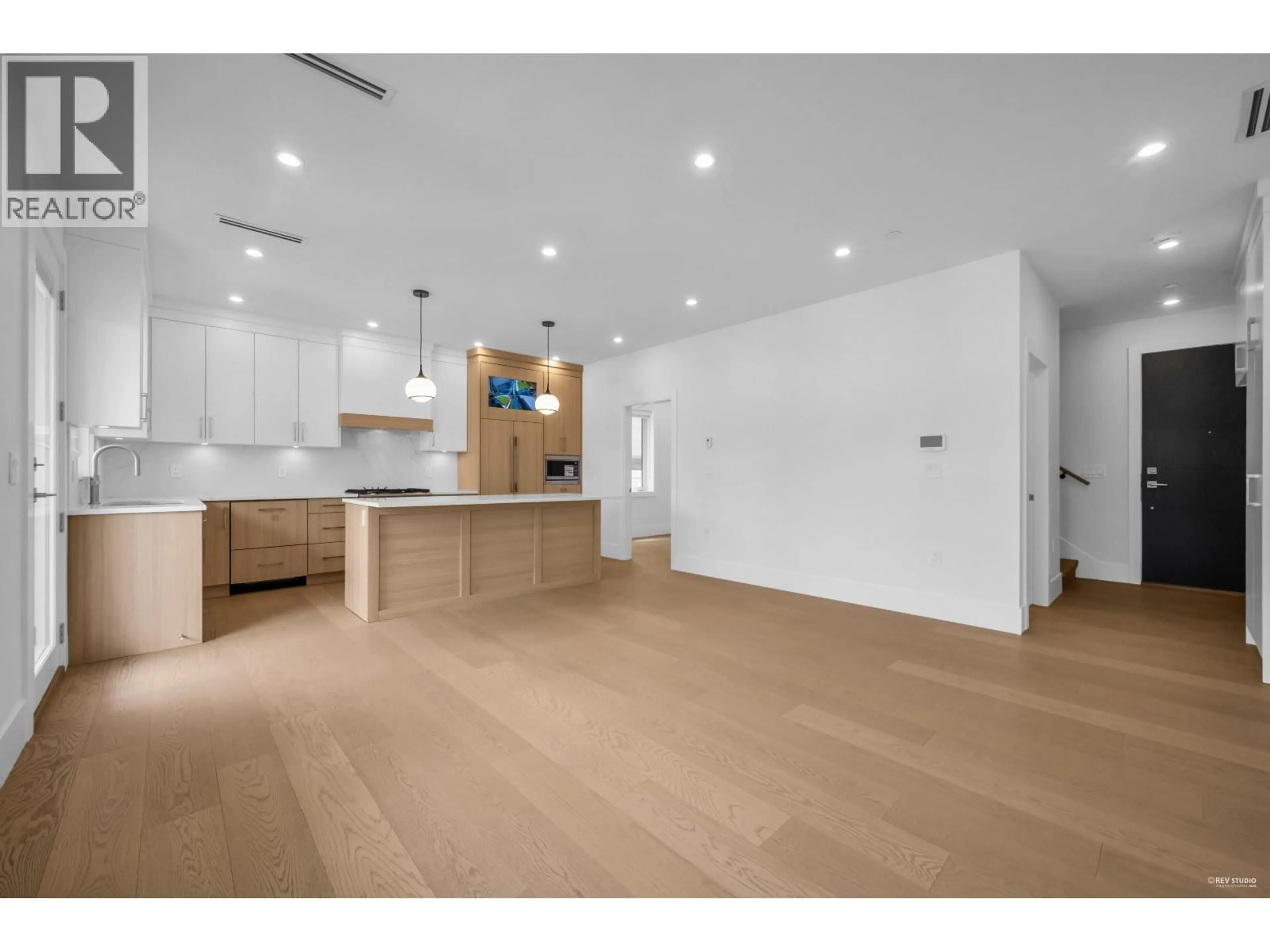 Open concept kitchen, wood/laminate floor for 3673 48TH AVENUE, Vancouver British Columbia V5S1J1