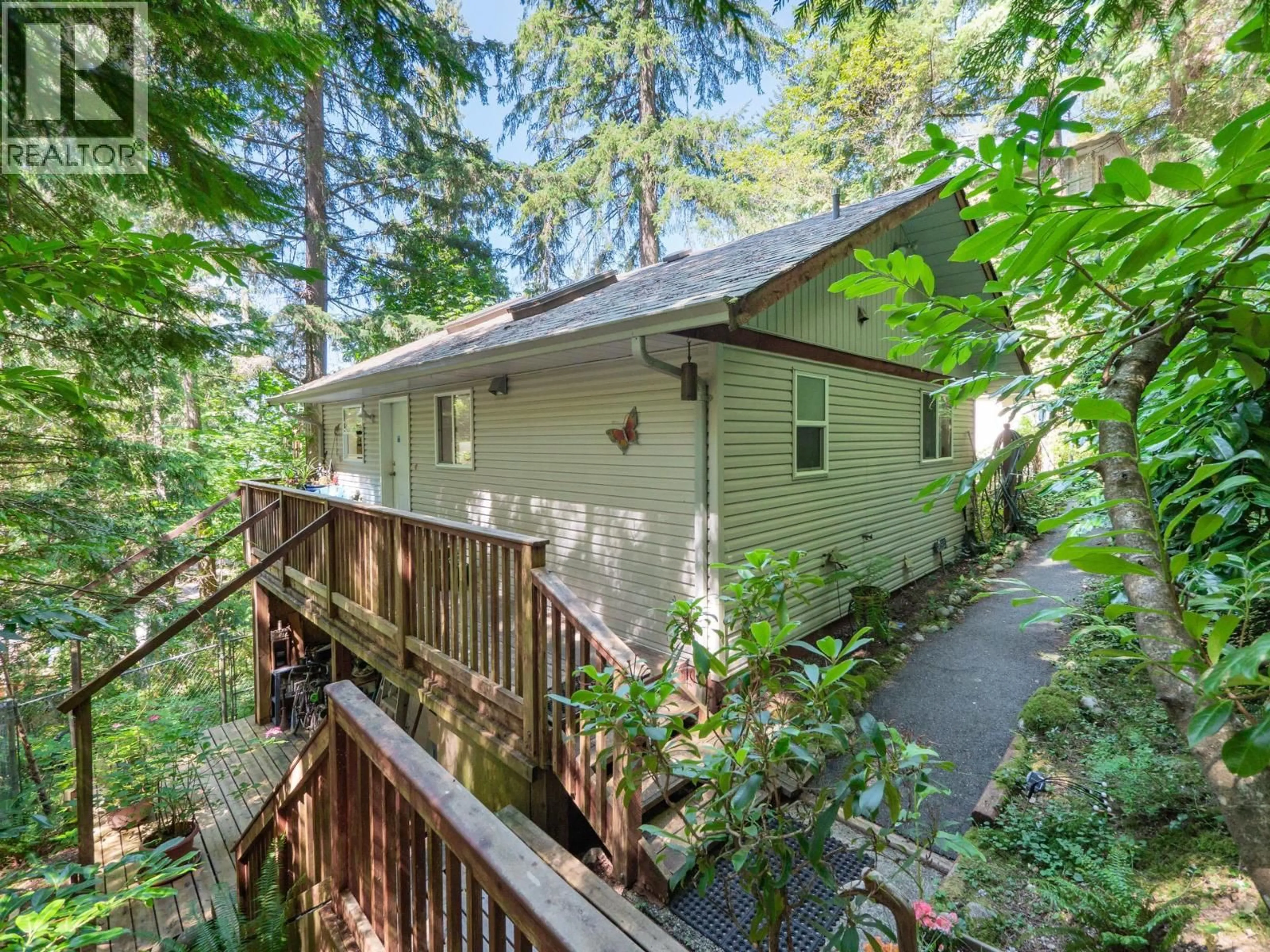 A pic from outside/outdoor area/front of a property/back of a property/a pic from drone, forest/trees view for 7027 SKANA CRESCENT, Sechelt British Columbia V7Z0C8